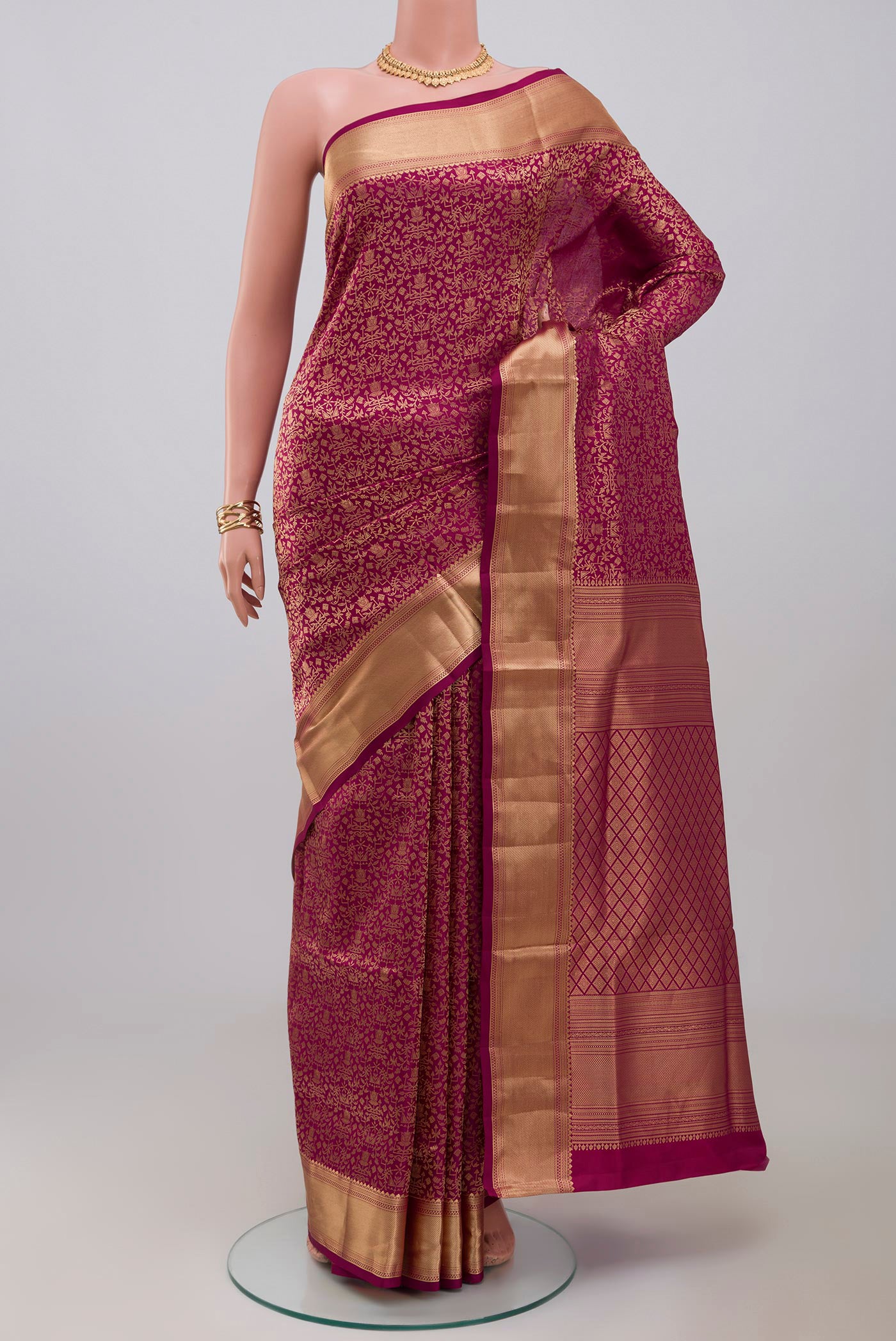 Magenta Soft Silk Saree with Zari Brocade on the body and Zari Border.  displayed on a mannequin