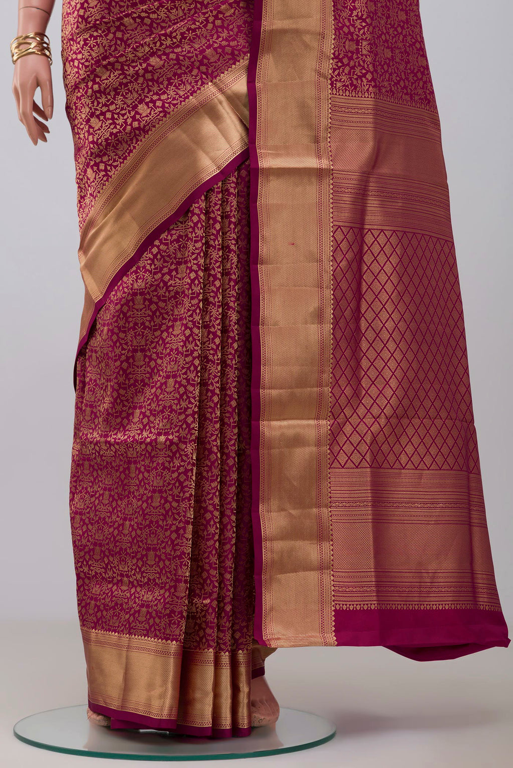 Pleats and pallu of Magenta Soft Silk Saree with Zari Brocade on the body and Zari Border. 