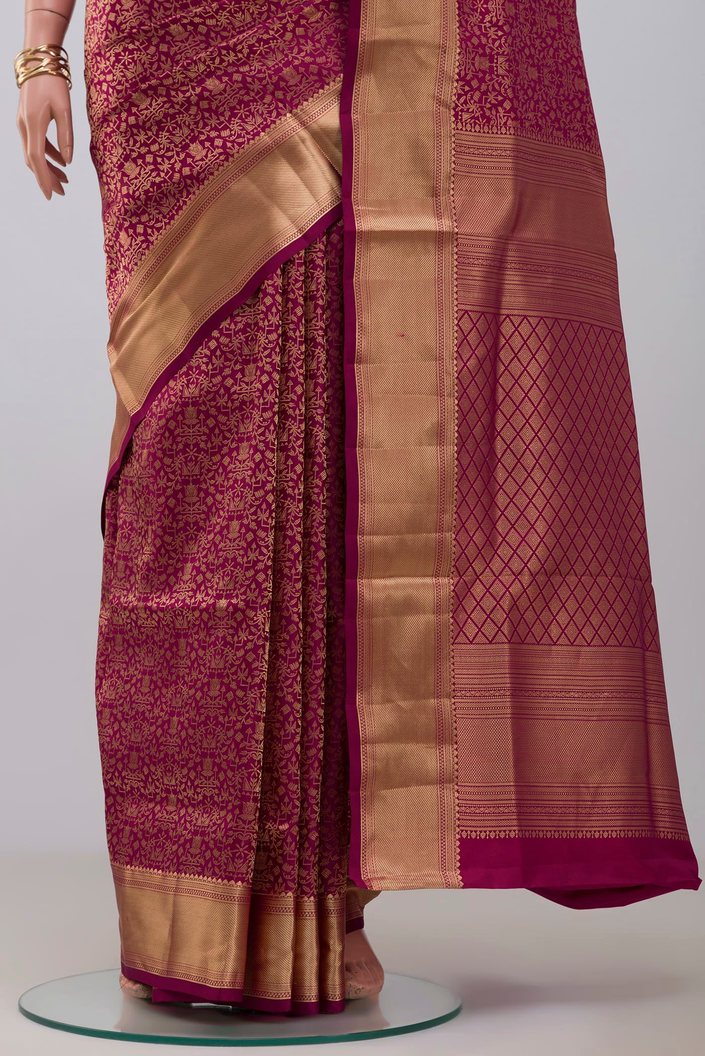 Pleats and pallu of Magenta Soft Silk Saree with Zari Brocade on the body and Zari Border. 