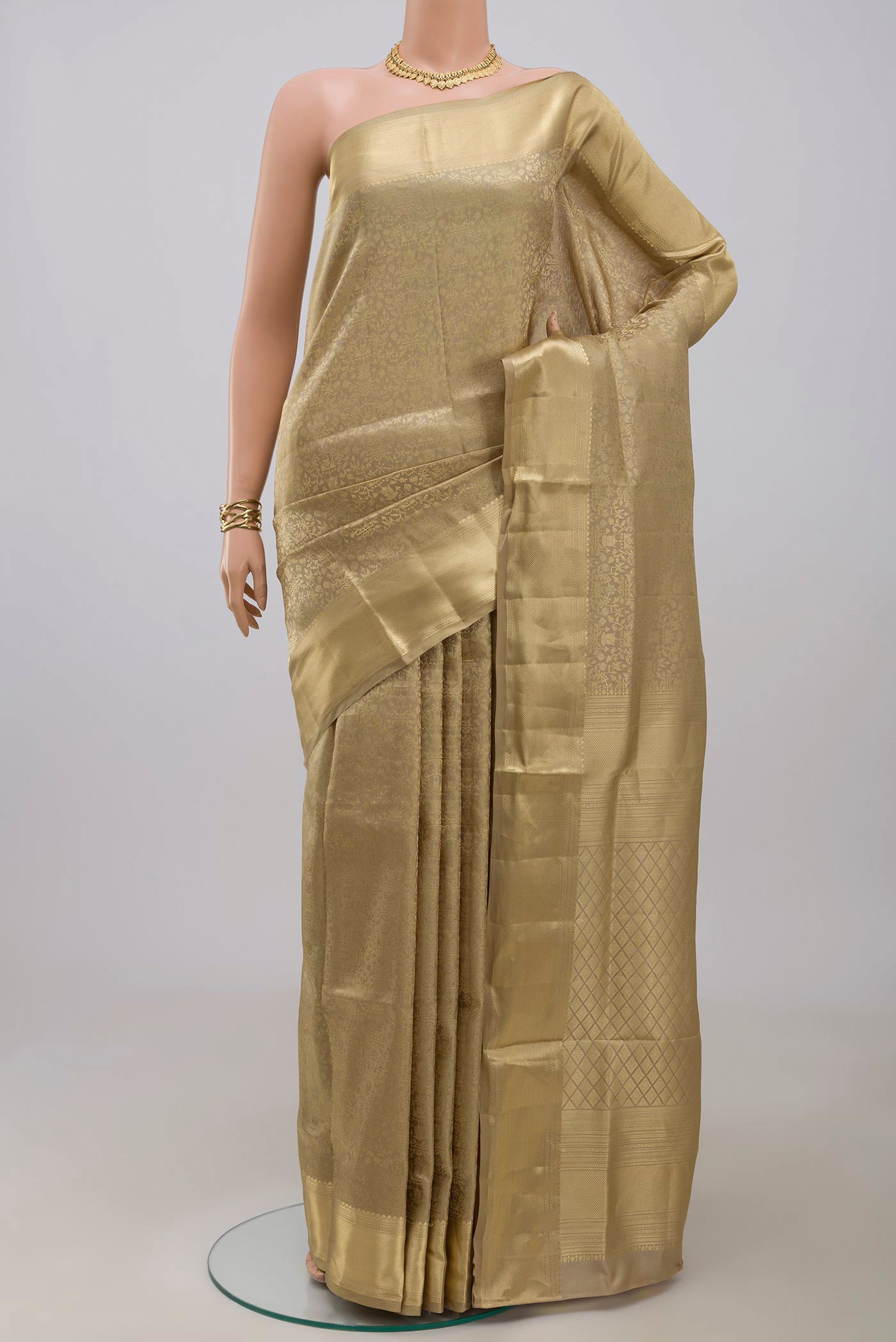Beige Soft Silk Saree with Zari Brocade on the body and Zari Border.  displayed on a mannequin