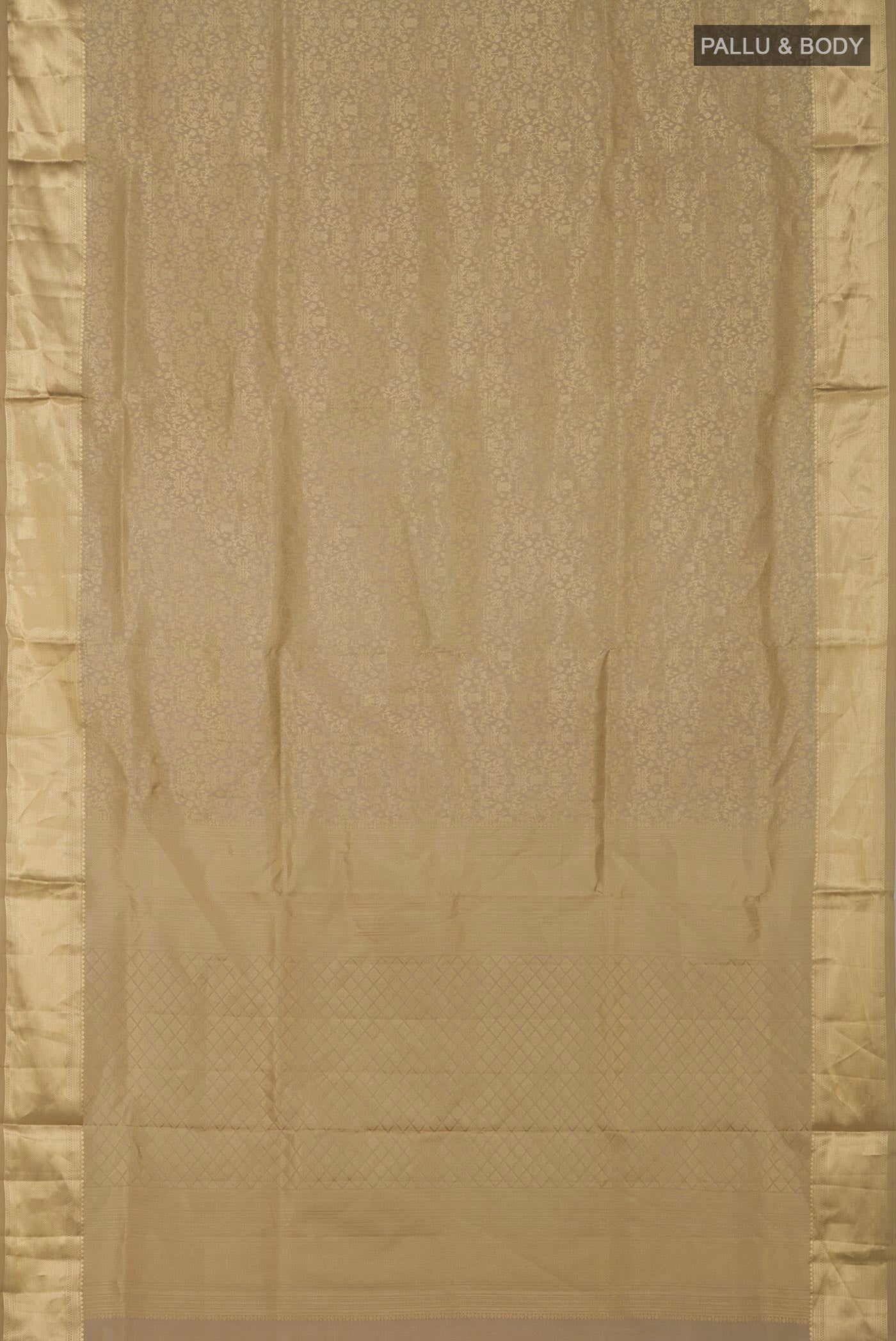 Flat view of Beige Soft Silk Saree with Zari Brocade on the body and Zari Border. 