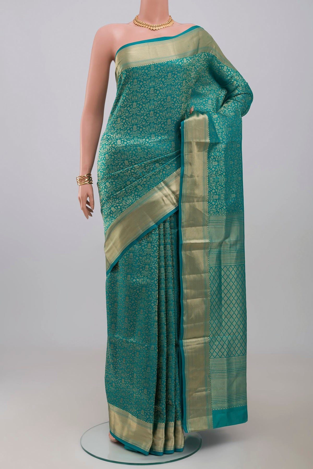Blue Soft Silk Saree with Zari Brocade on the body and Zari Border.  displayed on a mannequin