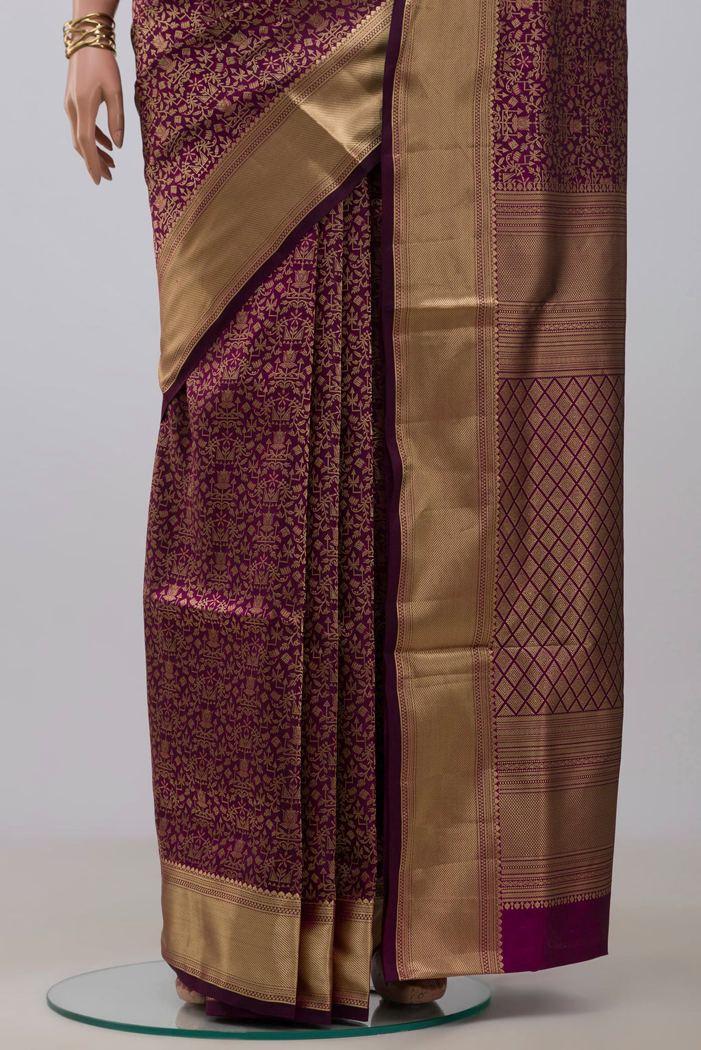 Pleats and pallu of Purple Soft Silk Saree with Zari Brocade on the body and Zari Border. 