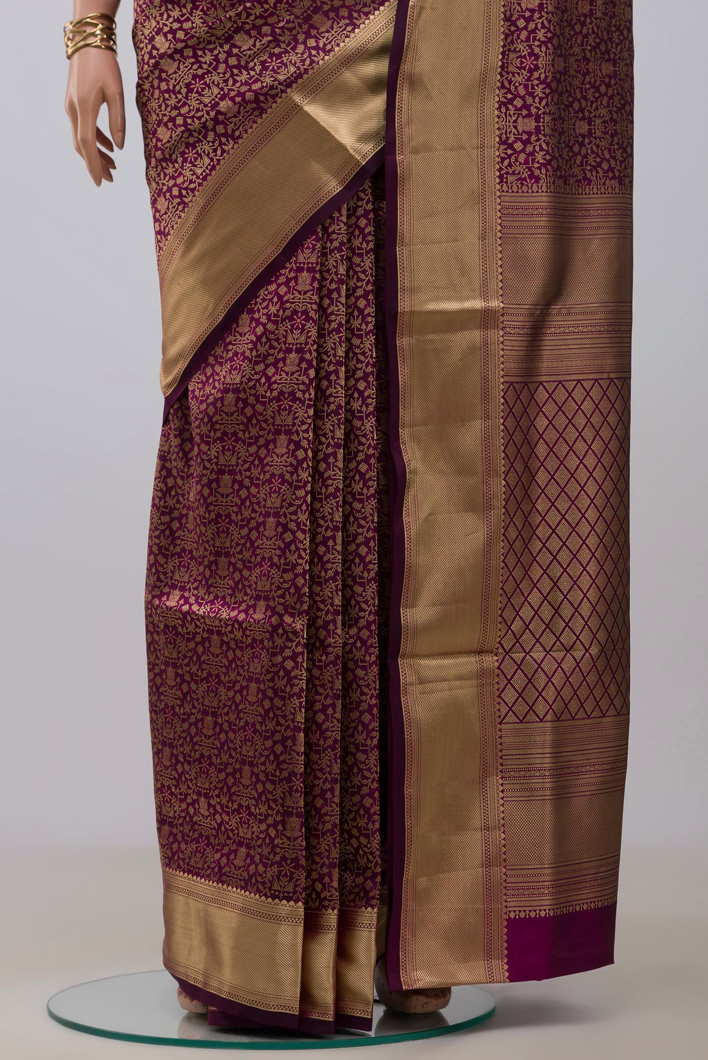 Pleats and pallu of Purple Soft Silk Saree with Zari Brocade on the body and Zari Border. 
