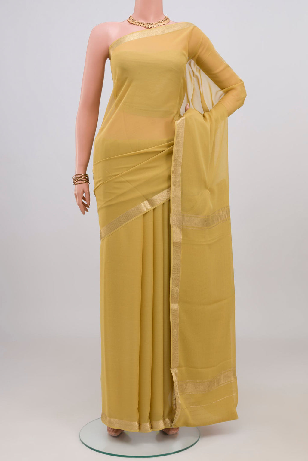 Sandal Mysore Georgette Saree with Plain Body and Zari Border.  displayed on a mannequin