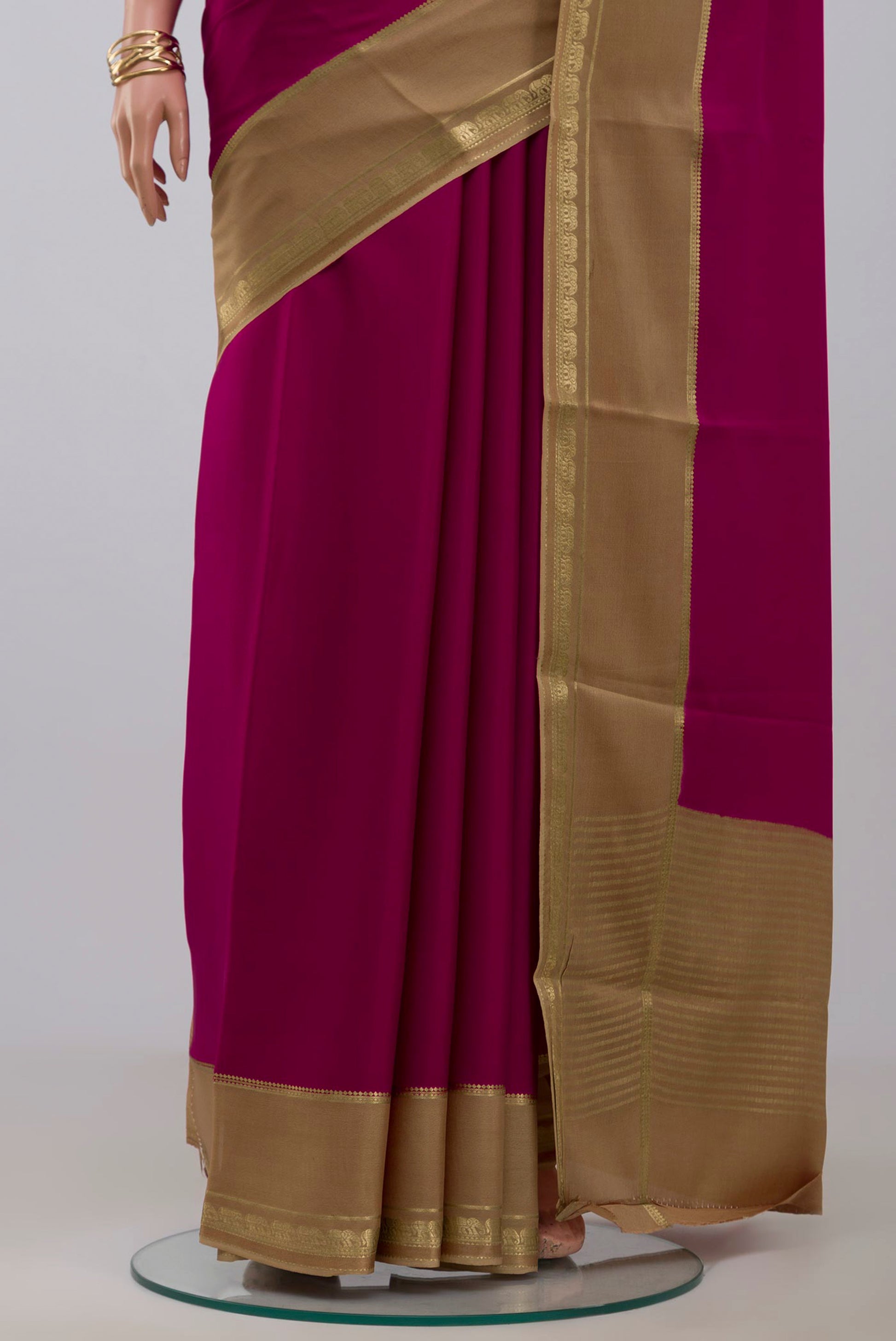 Pleats and pallu of Dark Pink Mysore Crepe Saree with Plain Body and Zari Border. 