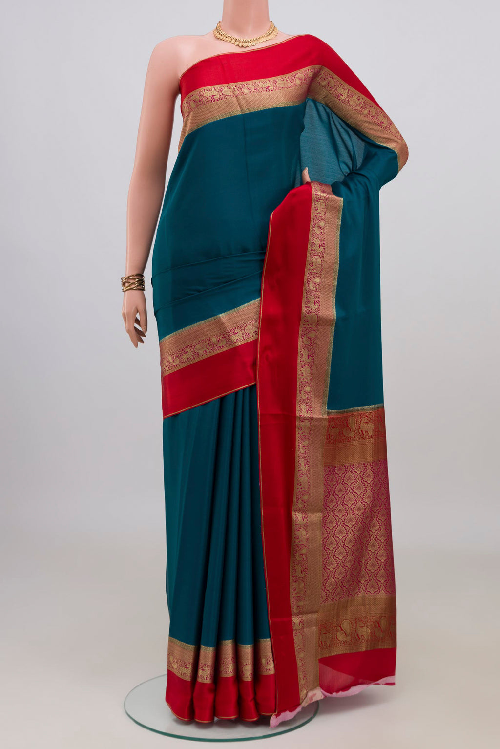Blue Mysore Crepe Saree with Plain Body and Zari Border.  displayed on a mannequin