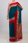 Blue Mysore Crepe Saree with Plain Body and Zari Border.  displayed on a mannequin