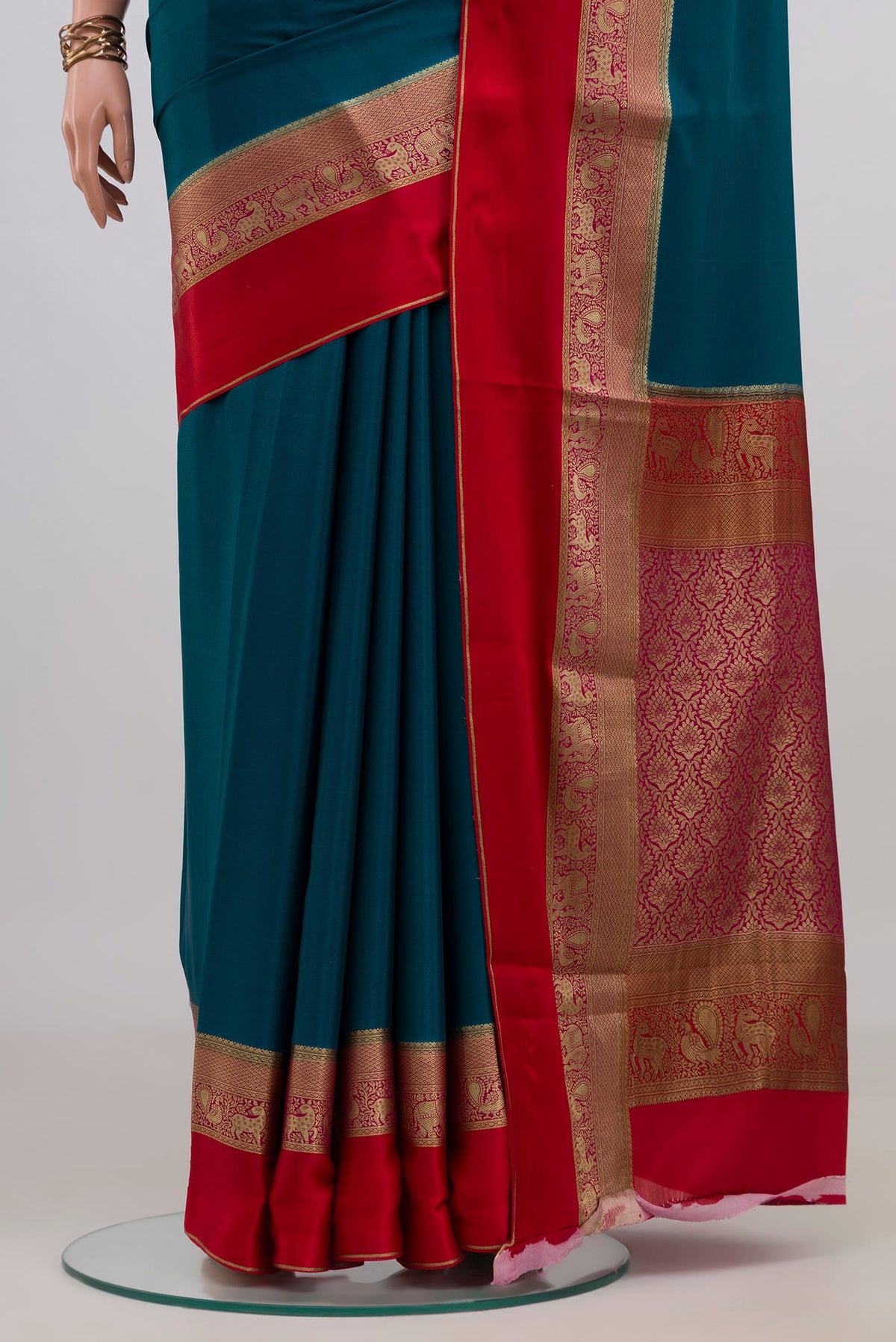 Pleats and pallu of Blue Mysore Crepe Saree with Plain Body and Zari Border. 