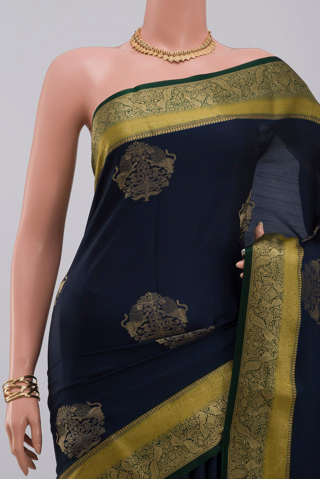 Border image of Blue Crepe Saree with Zari Butta on the body and Fancy Border. 