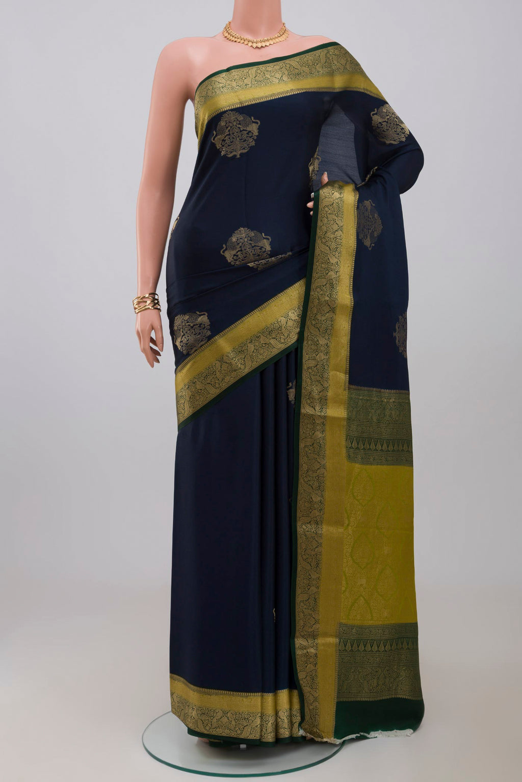 Blue Crepe Saree with Zari Butta on the body and Fancy Border.  displayed on a mannequin