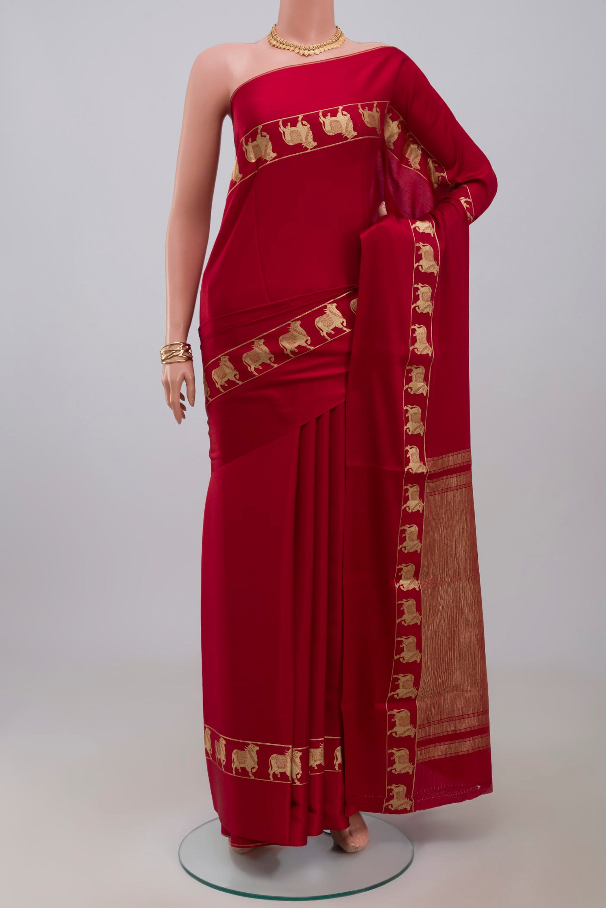 Red Mysore Crepe Saree with Plain Body and Zari Border.  displayed on a mannequin