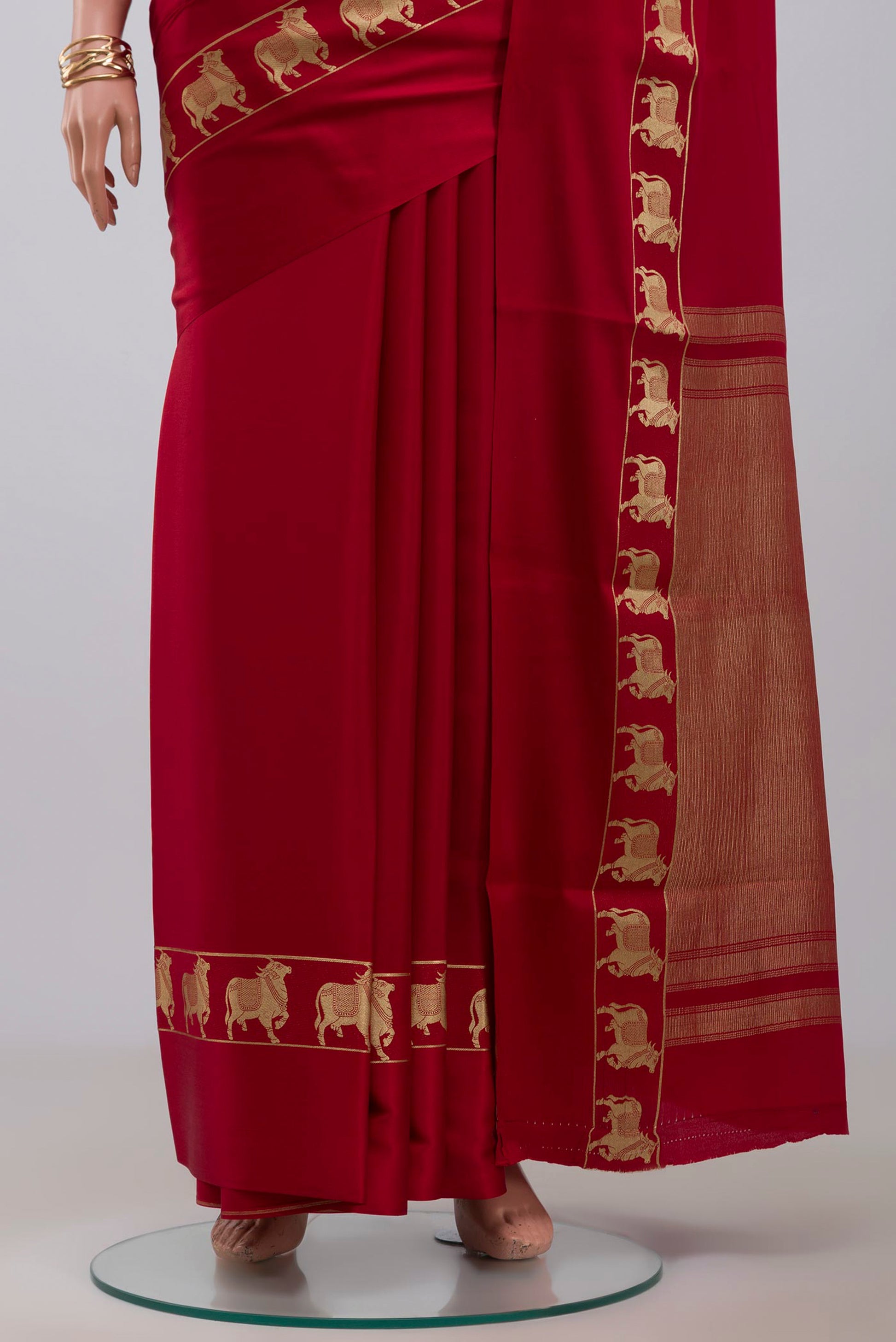 Pleats and pallu of Red Mysore Crepe Saree with Plain Body and Zari Border. 