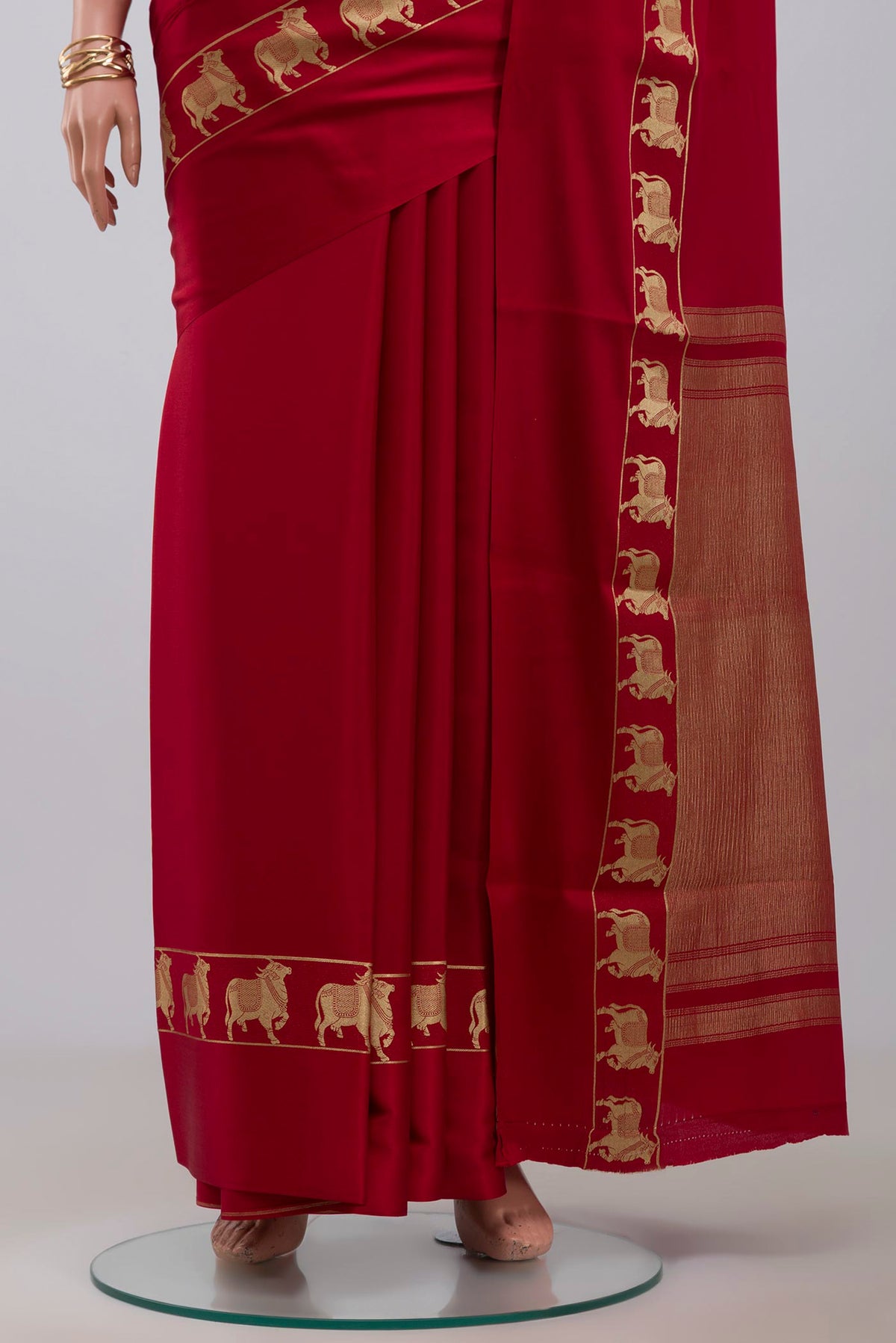 Pleats and pallu of Red Mysore Crepe Saree with Plain Body and Zari Border. 