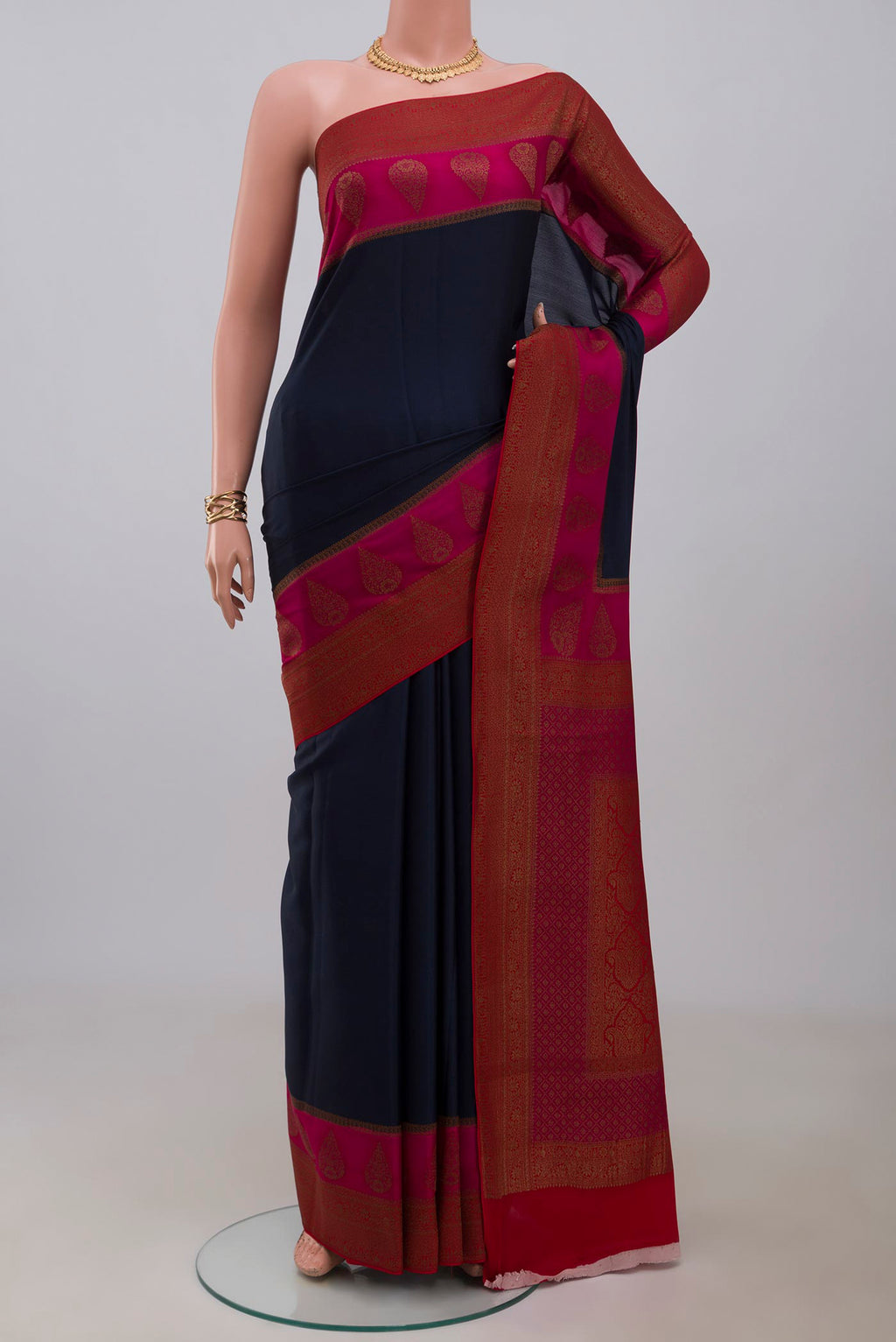 Blue Crepe Saree with Plain Body and Fancy Border.  displayed on a mannequin