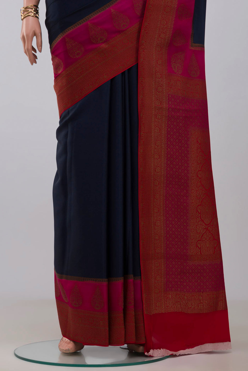 Pleats and pallu of Blue Crepe Saree with Plain Body and Fancy Border. 