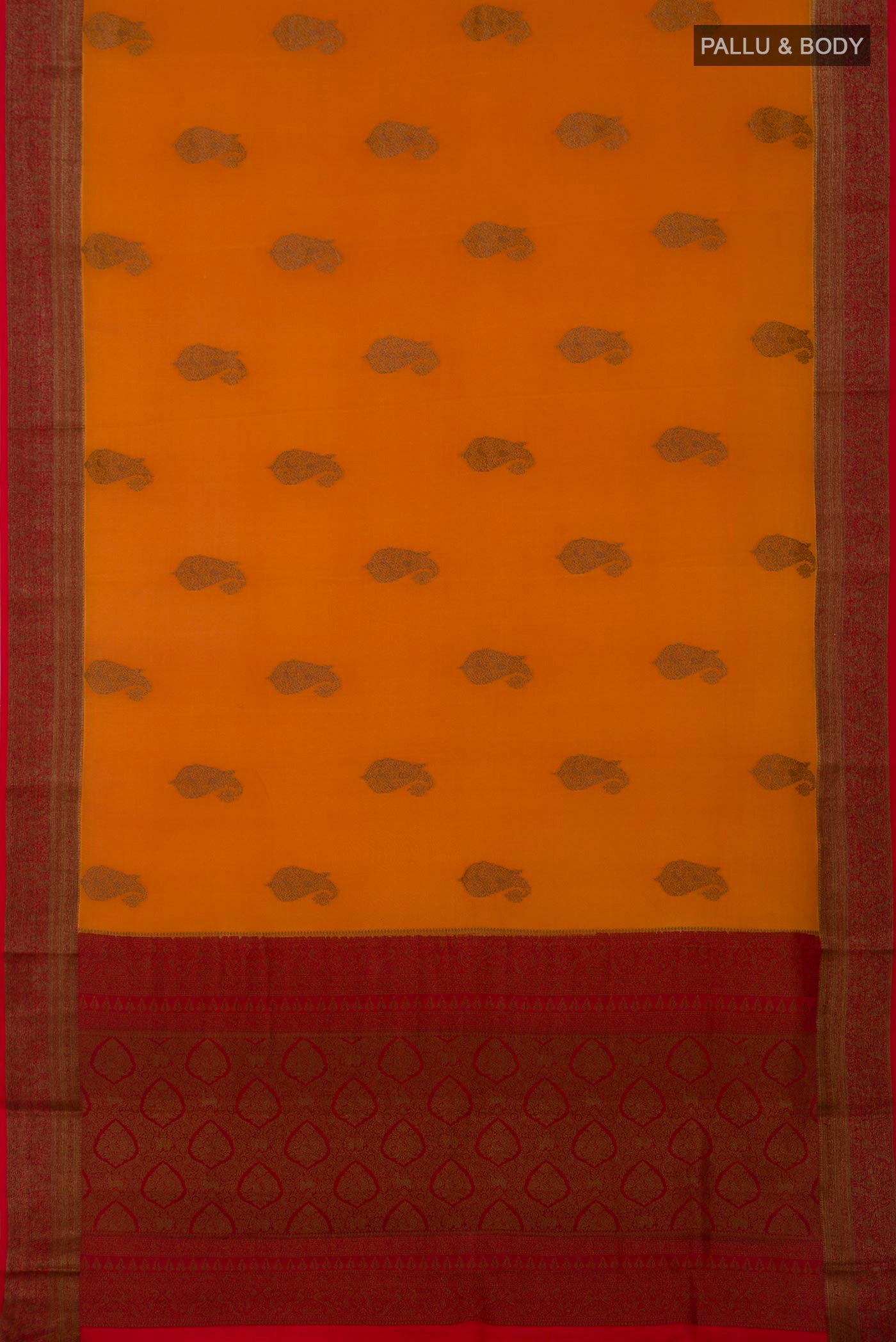 Flat view of Orange Crepe Saree with Zari Butta on the body and Zari Border. 