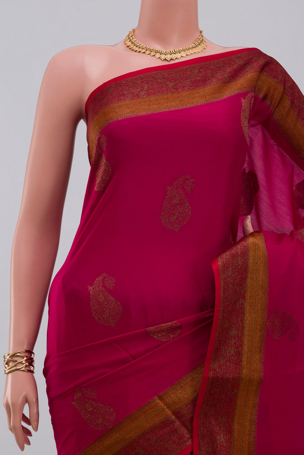 Border image of Pink Crepe Saree with Zari Butta on the body and Fancy Border. 