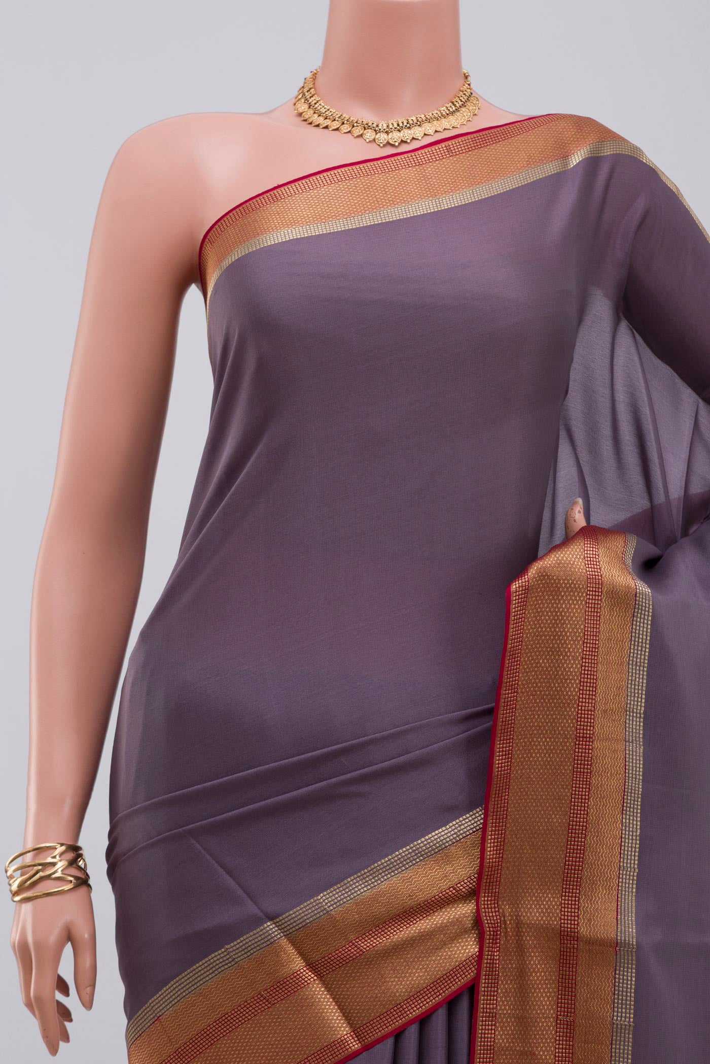 Border image of Lavender Crepe Saree with Plain Body and Zari Border. 