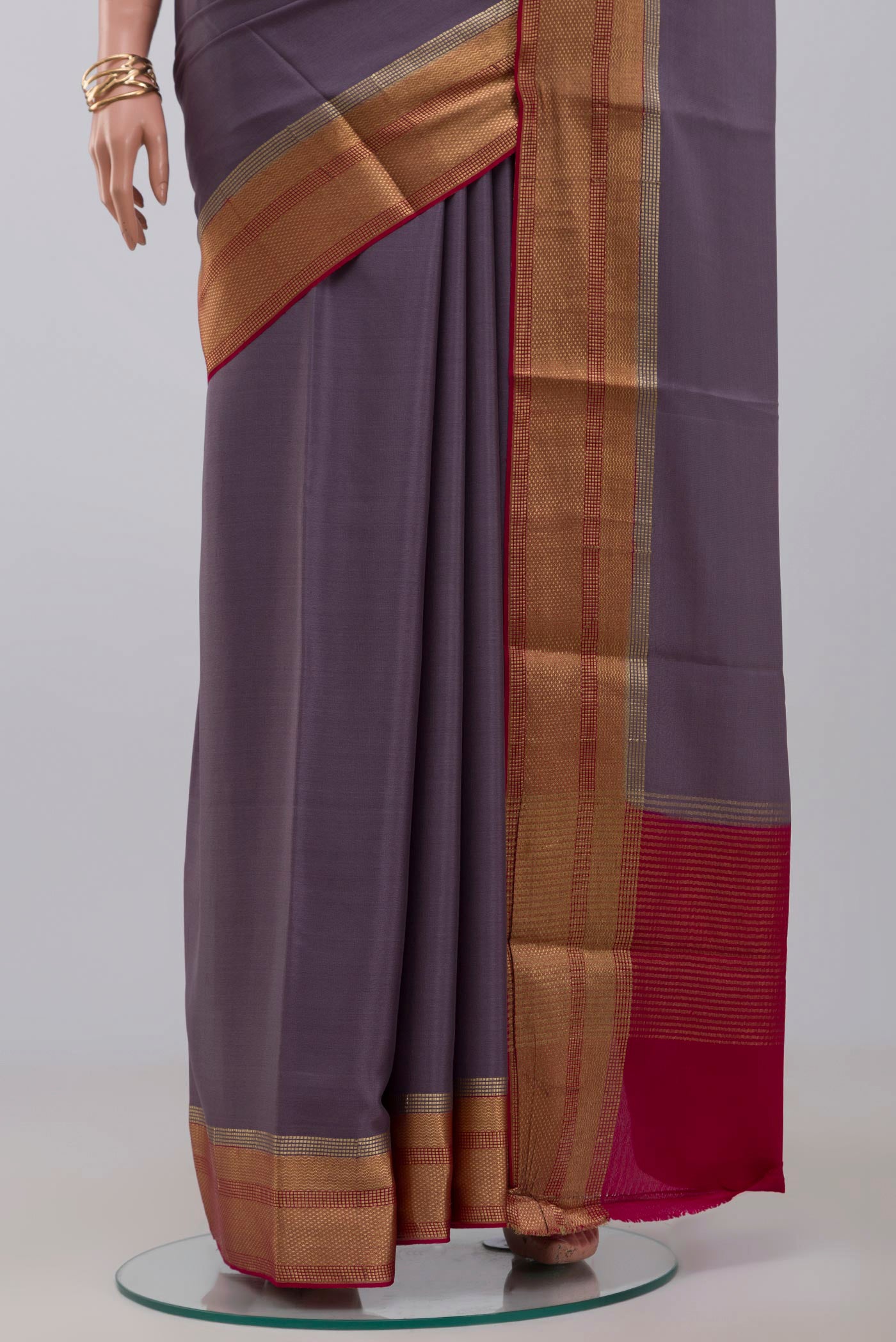 Pleats and pallu of Lavender Crepe Saree with Plain Body and Zari Border. 
