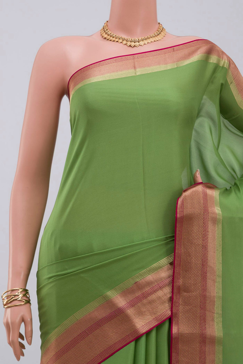 Border image of Parrot Green Mysore Crepe Saree with Plain Body and Zari Border. 