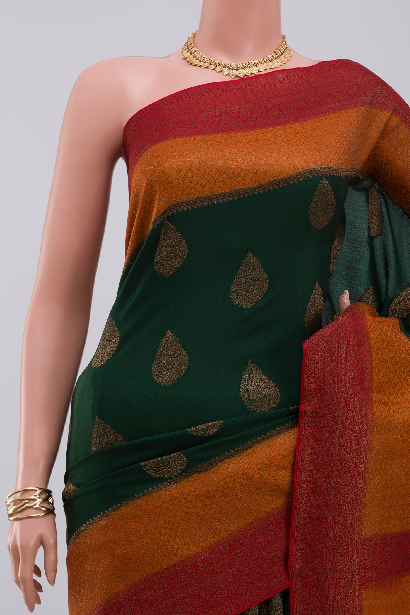 Border image of Green Crepe Saree with Zari Butta on the body and Zari Border. 