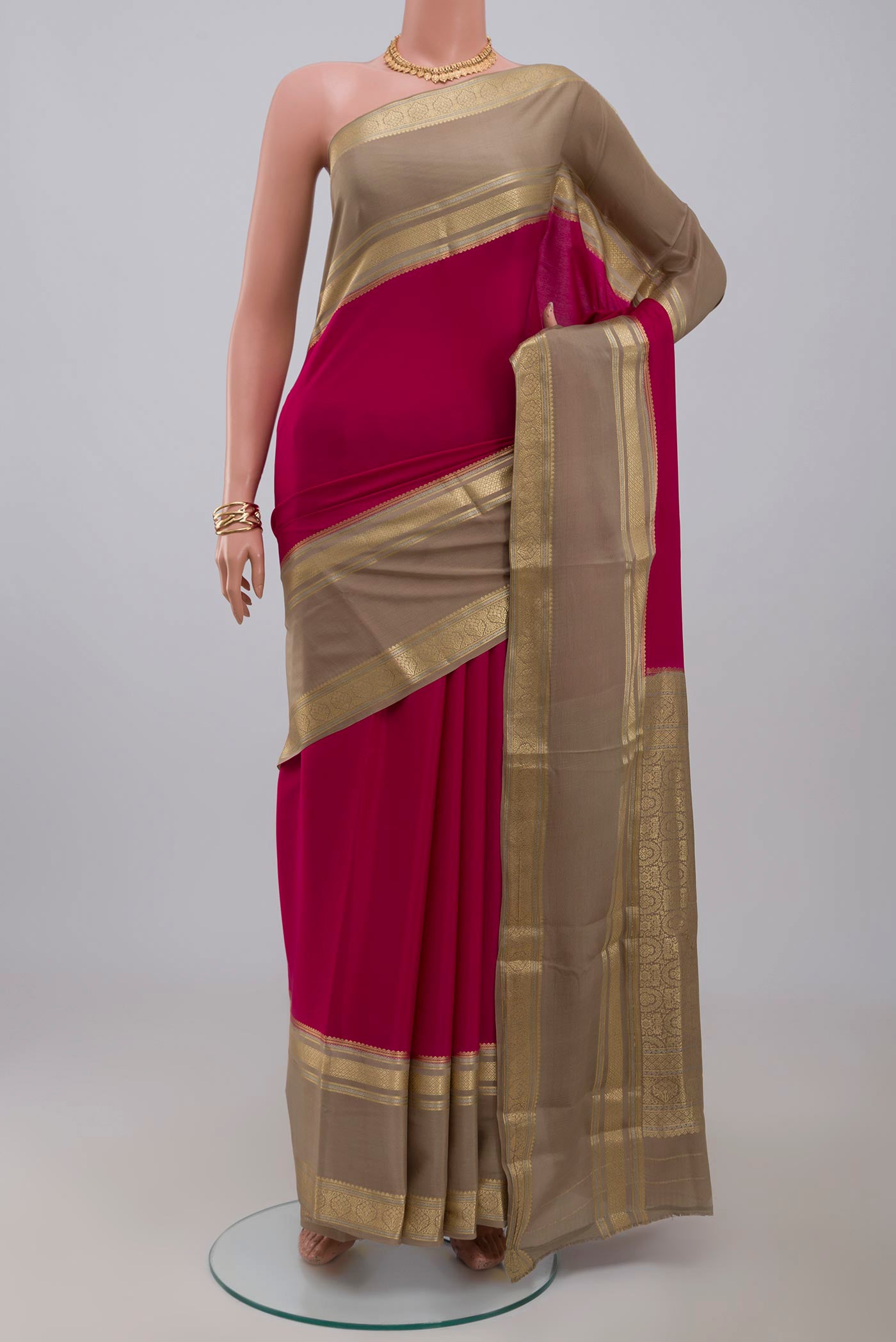 Pink Crepe Saree with Plain Body and Zari Border.  displayed on a mannequin