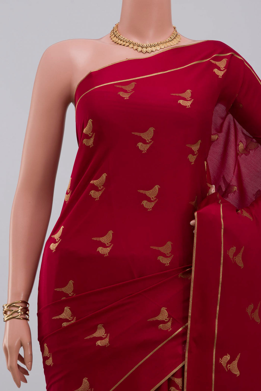 Border image of Red Crepe Saree with Zari Butta on the body and Thin Zari Line. 
