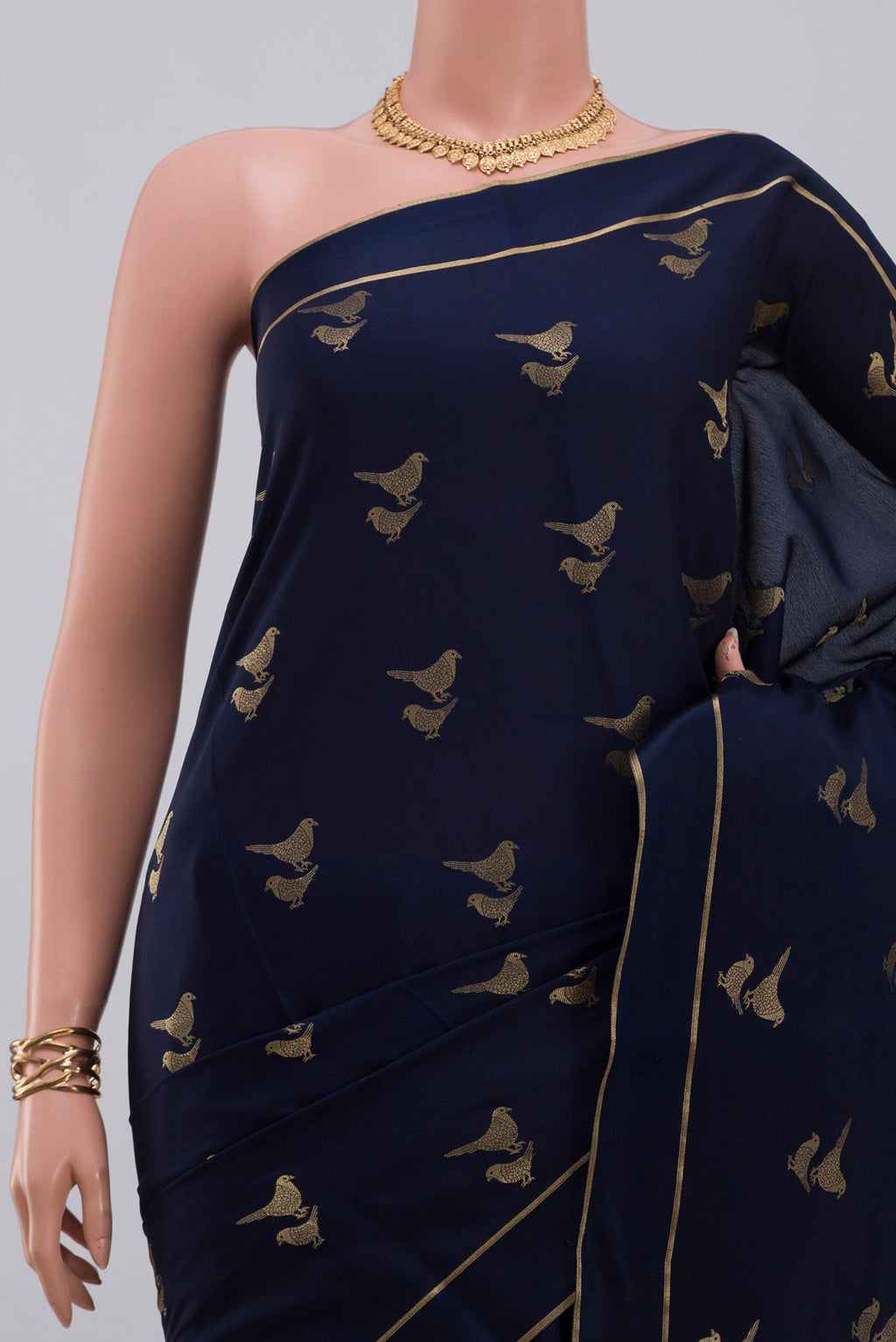 Border image of Blue Crepe Saree with Zari Butta on the body and Thin Zari Line. 