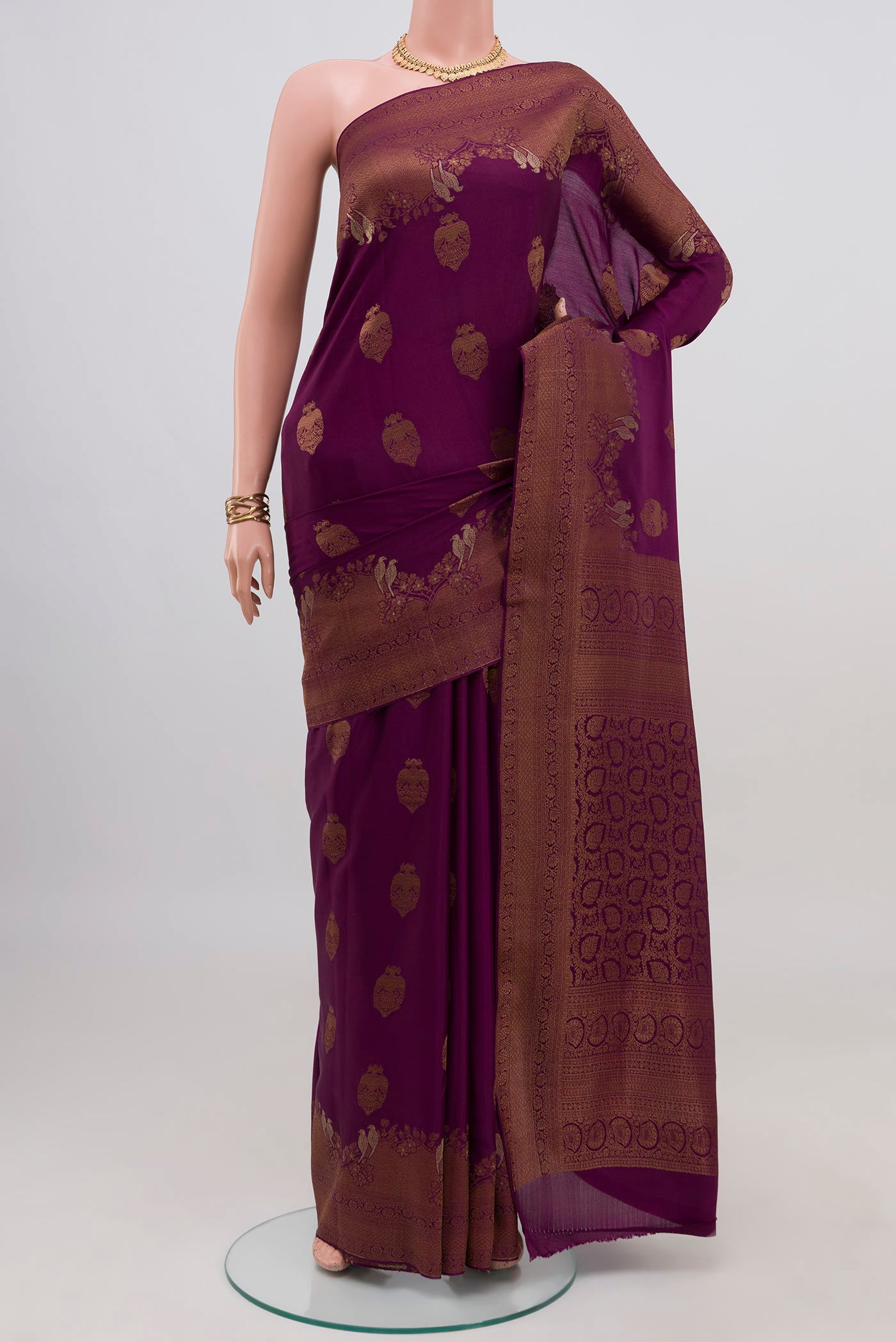 Purple Mysore Crepe Saree with Zari Butta on the body and Fancy Border.  displayed on a mannequin