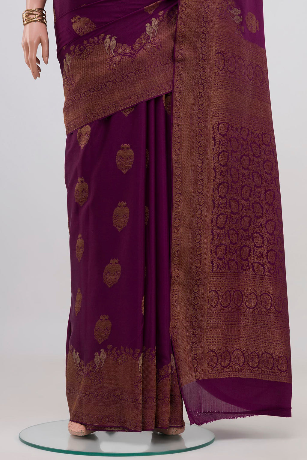 Pleats and pallu of Purple Mysore Crepe Saree with Zari Butta on the body and Fancy Border. 
