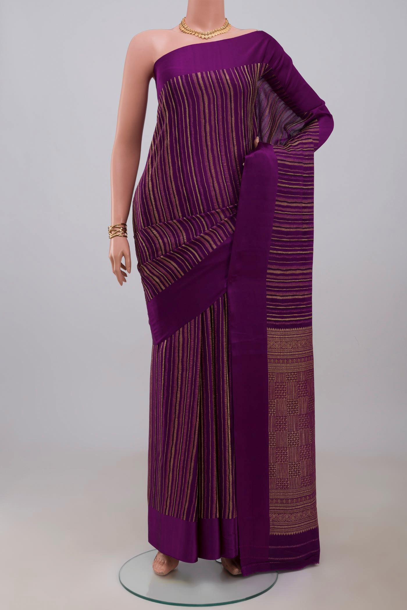 Purple Mysore Crepe Saree with Stripes on the body and Plain Border.  displayed on a mannequin