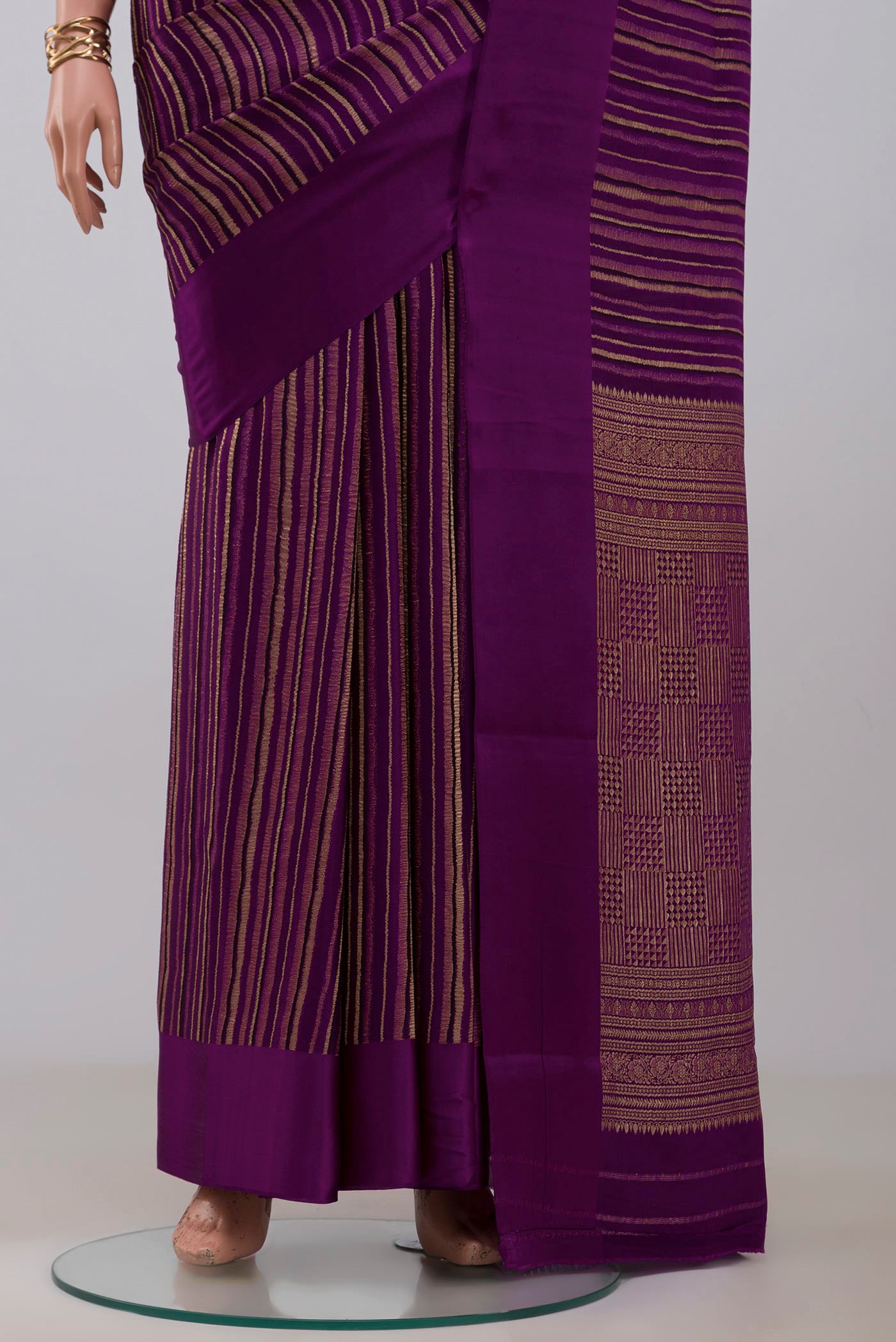 Pleats and pallu of Purple Mysore Crepe Saree with Stripes on the body and Plain Border. 