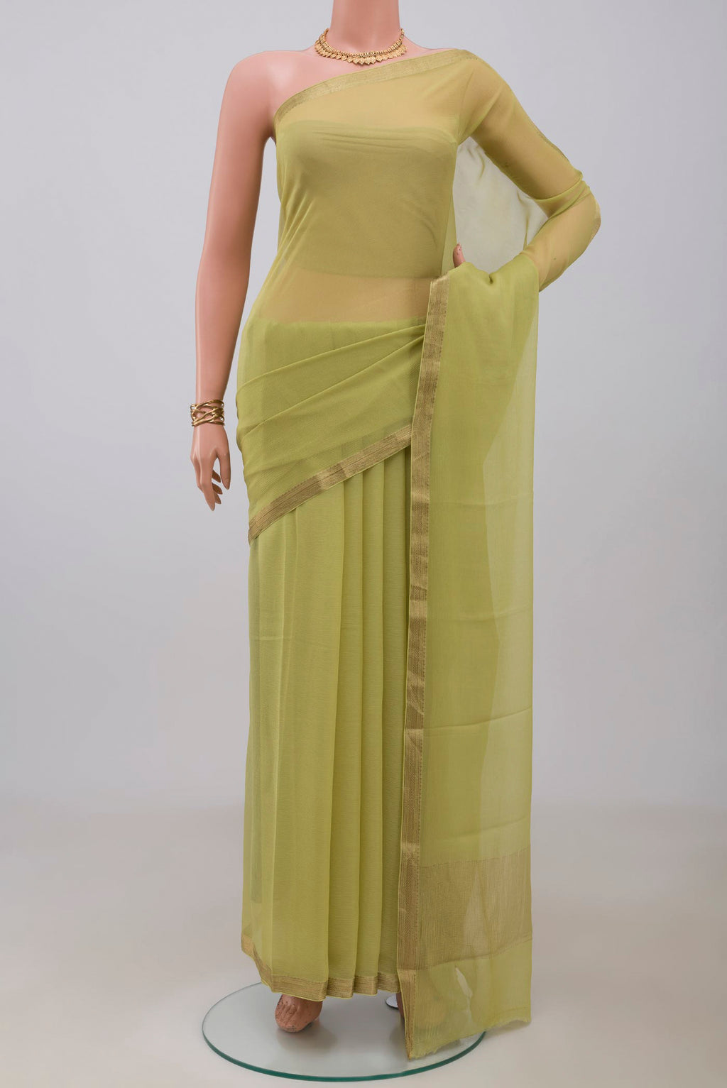 Light Green Mysore Chiffon Saree with Plain Body and Zari Border.  displayed on a mannequin