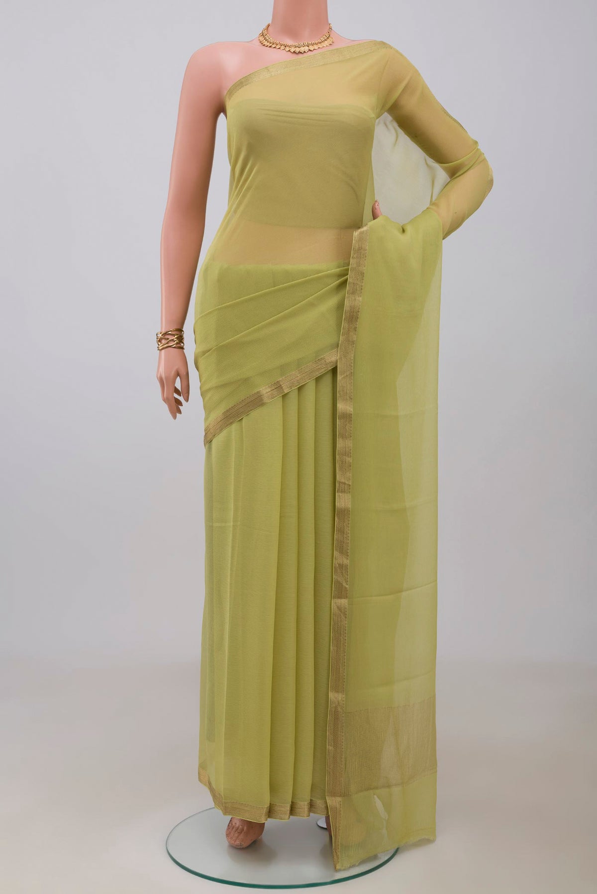 Light Green Mysore Chiffon Saree with Plain Body and Zari Border.  displayed on a mannequin