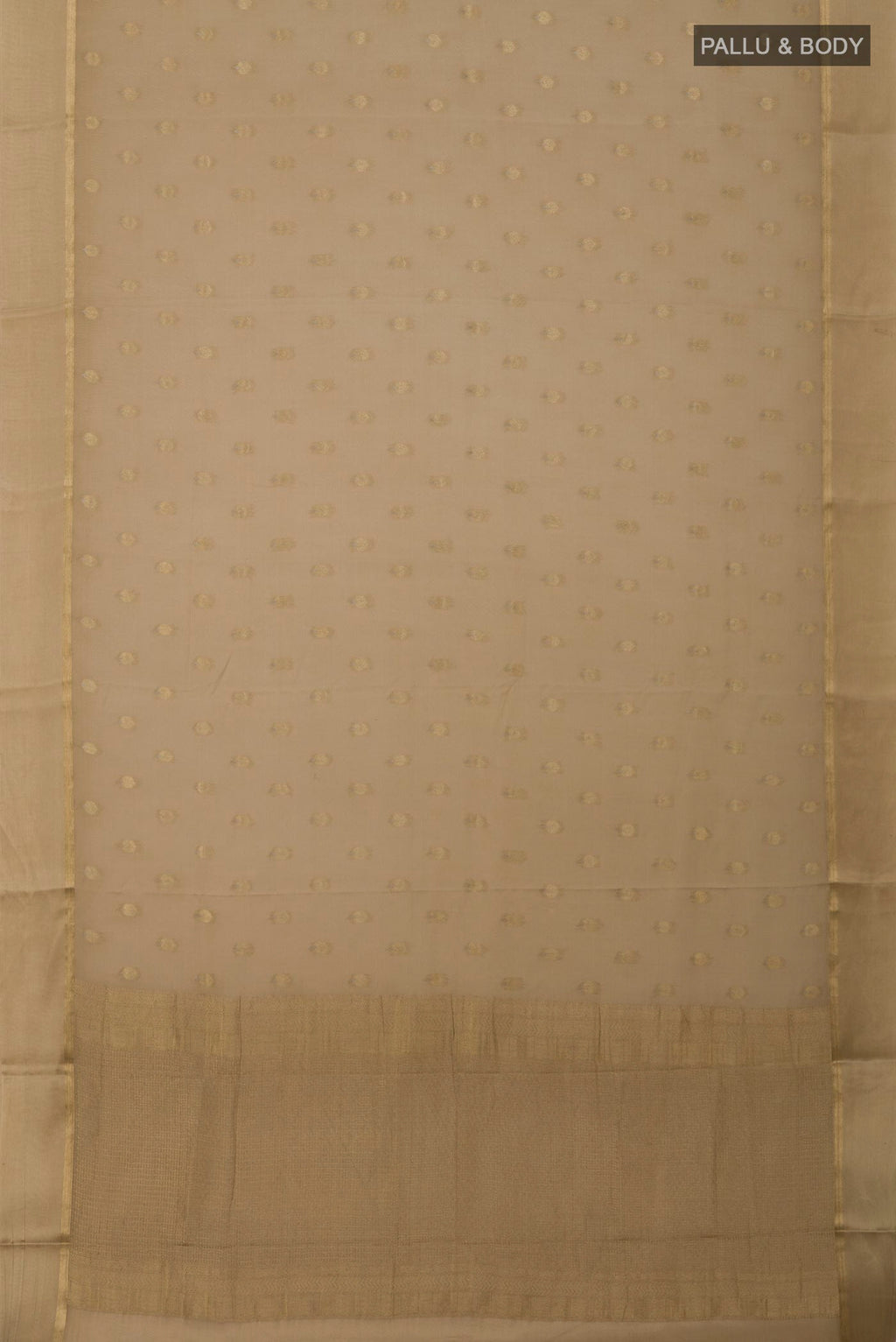 Flat view of Beige Crepe Saree with Zari Butta on the body and Thin Zari Line. 