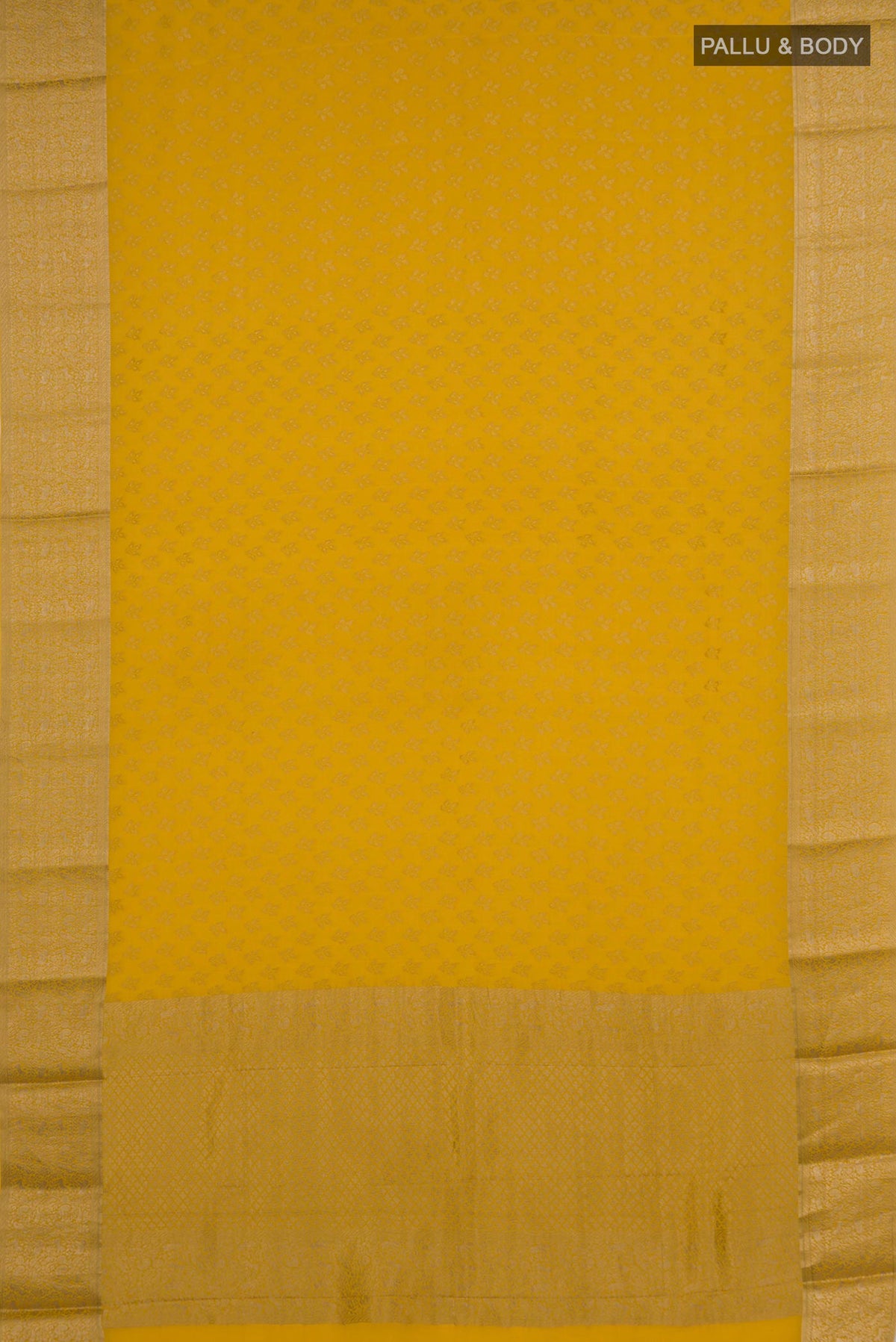 Flat view of Yellow Mysore Crepe Saree with Zari Butta on the body and Zari Border. 