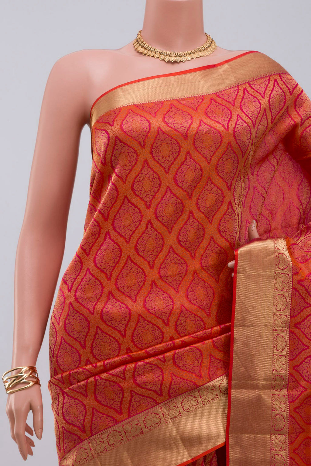 Border image of Orange Soft Silk Saree with Zari Brocade on the body and Zari Border. 