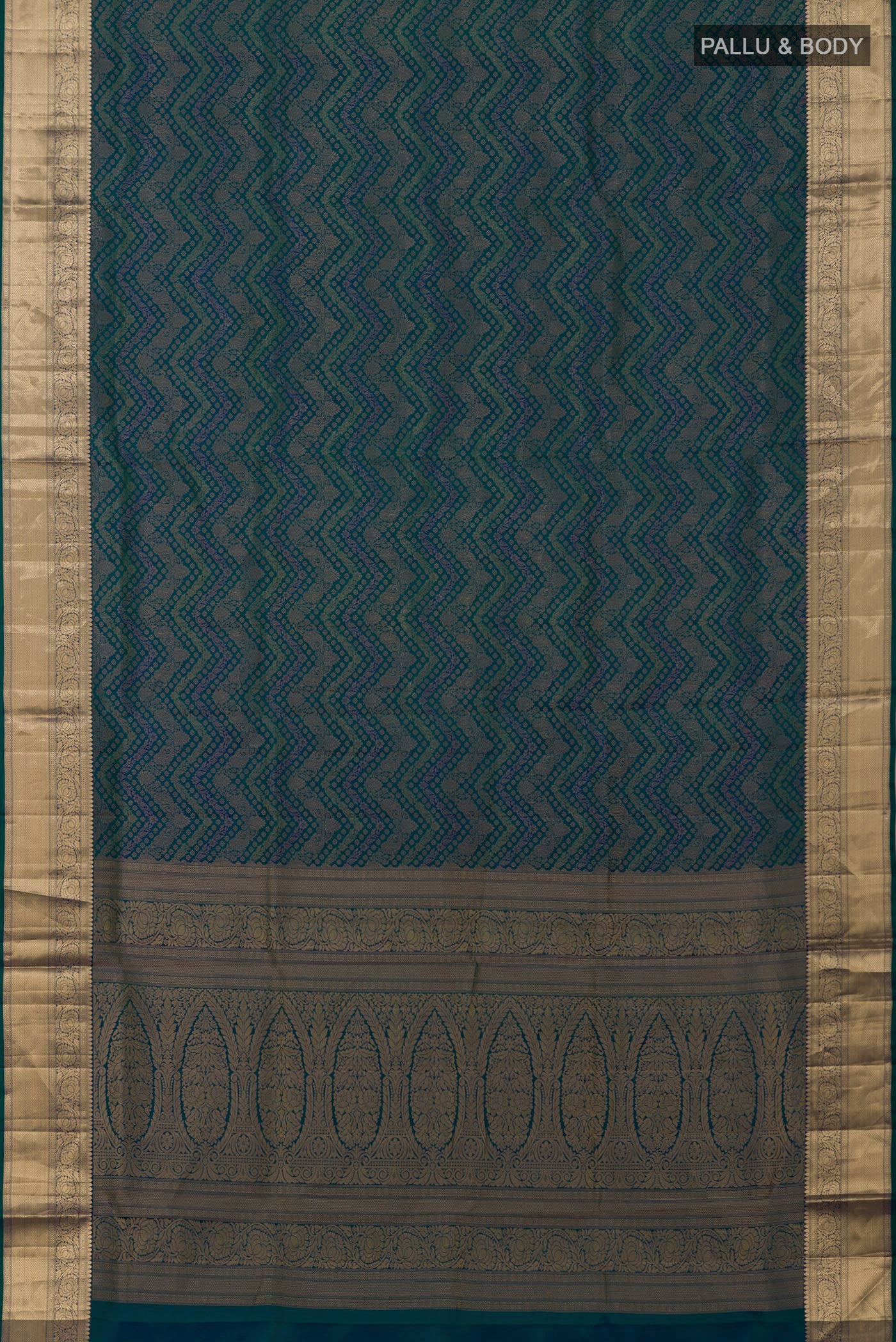 Flat view of Peacock Blue Dual Tone Soft Silk Saree with Zari Brocade on the body and Zari Border. 