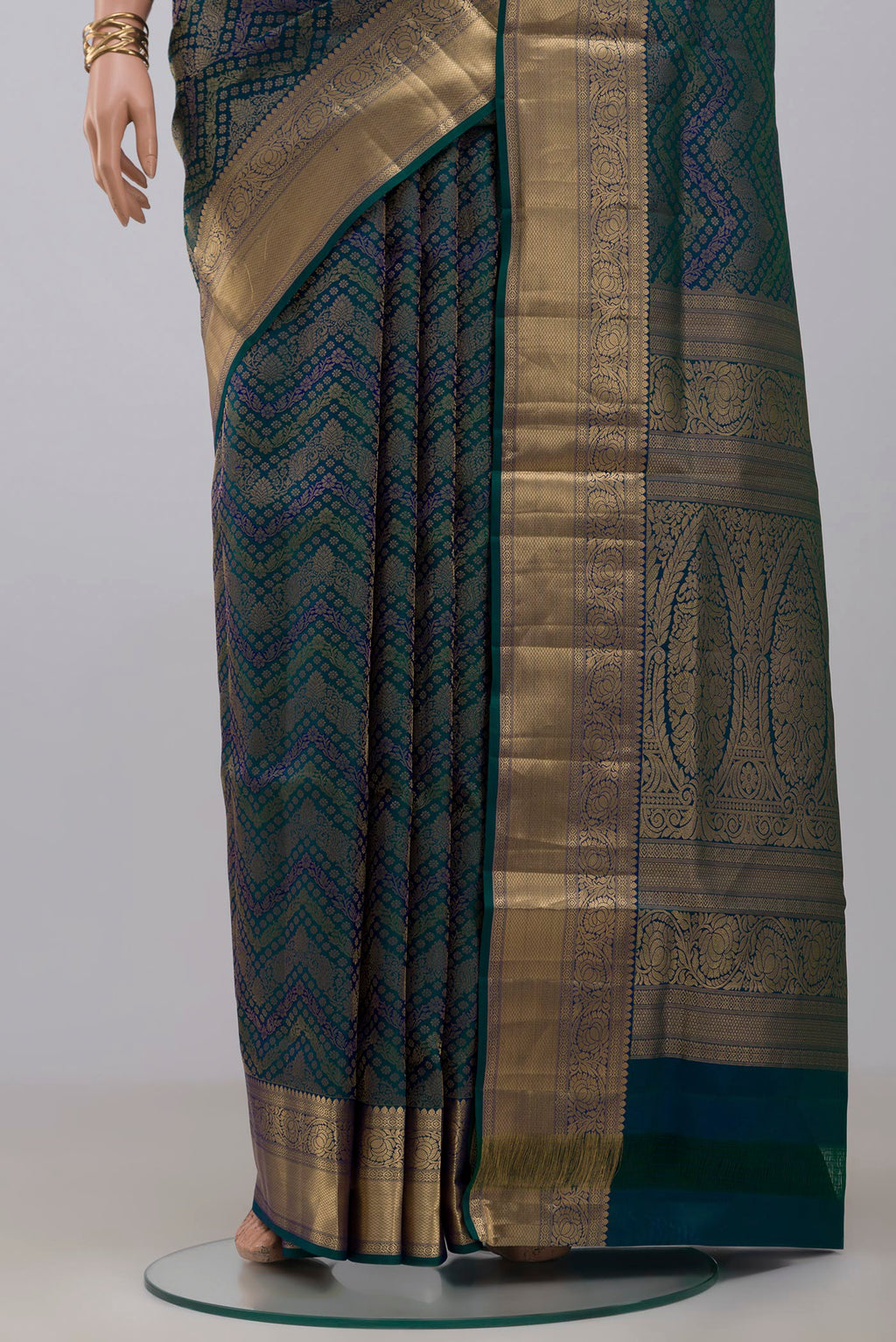 Pleats and pallu of Peacock Blue Dual Tone Soft Silk Saree with Zari Brocade on the body and Zari Border. 