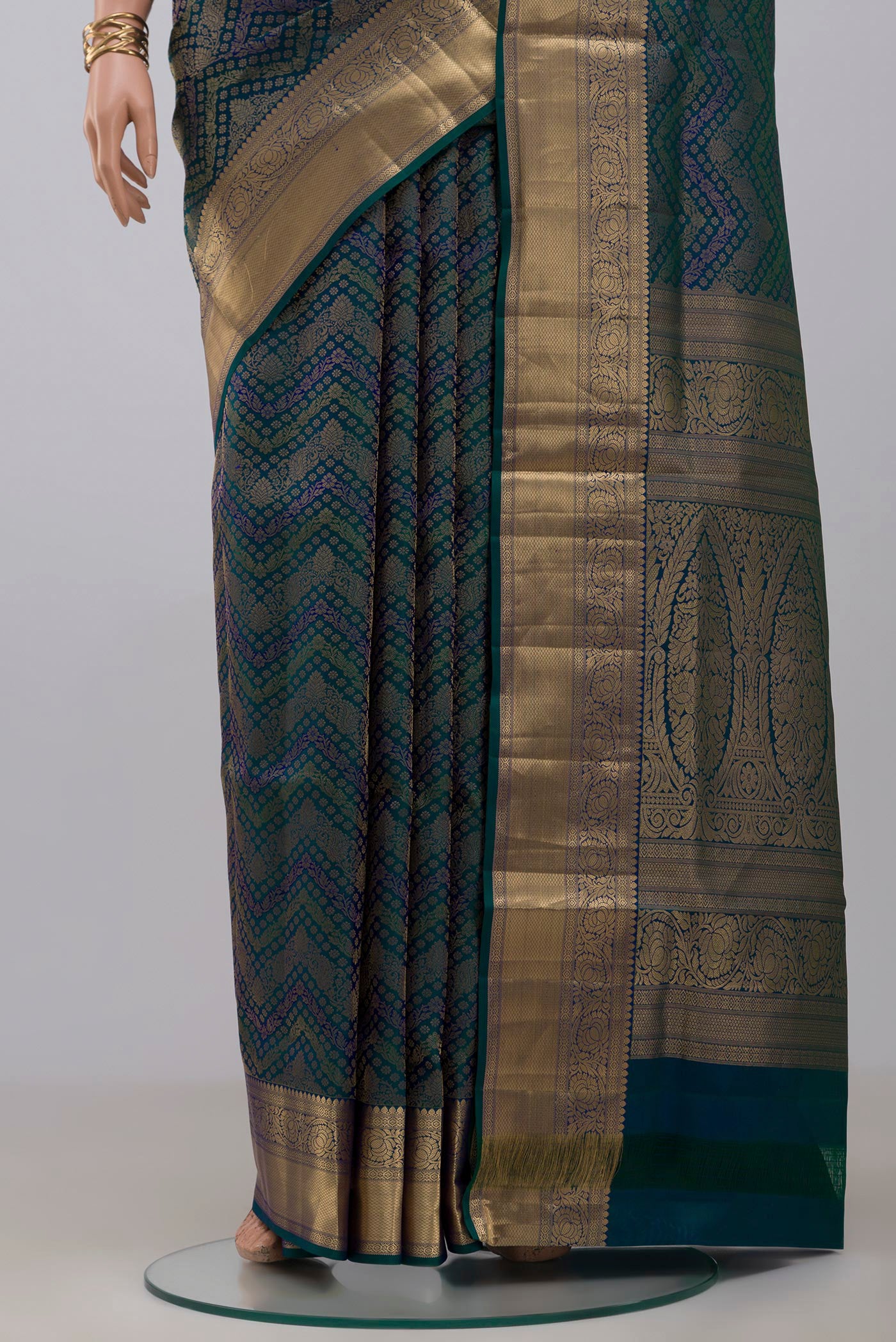Pleats and pallu of Peacock Blue Dual Tone Soft Silk Saree with Zari Brocade on the body and Zari Border. 