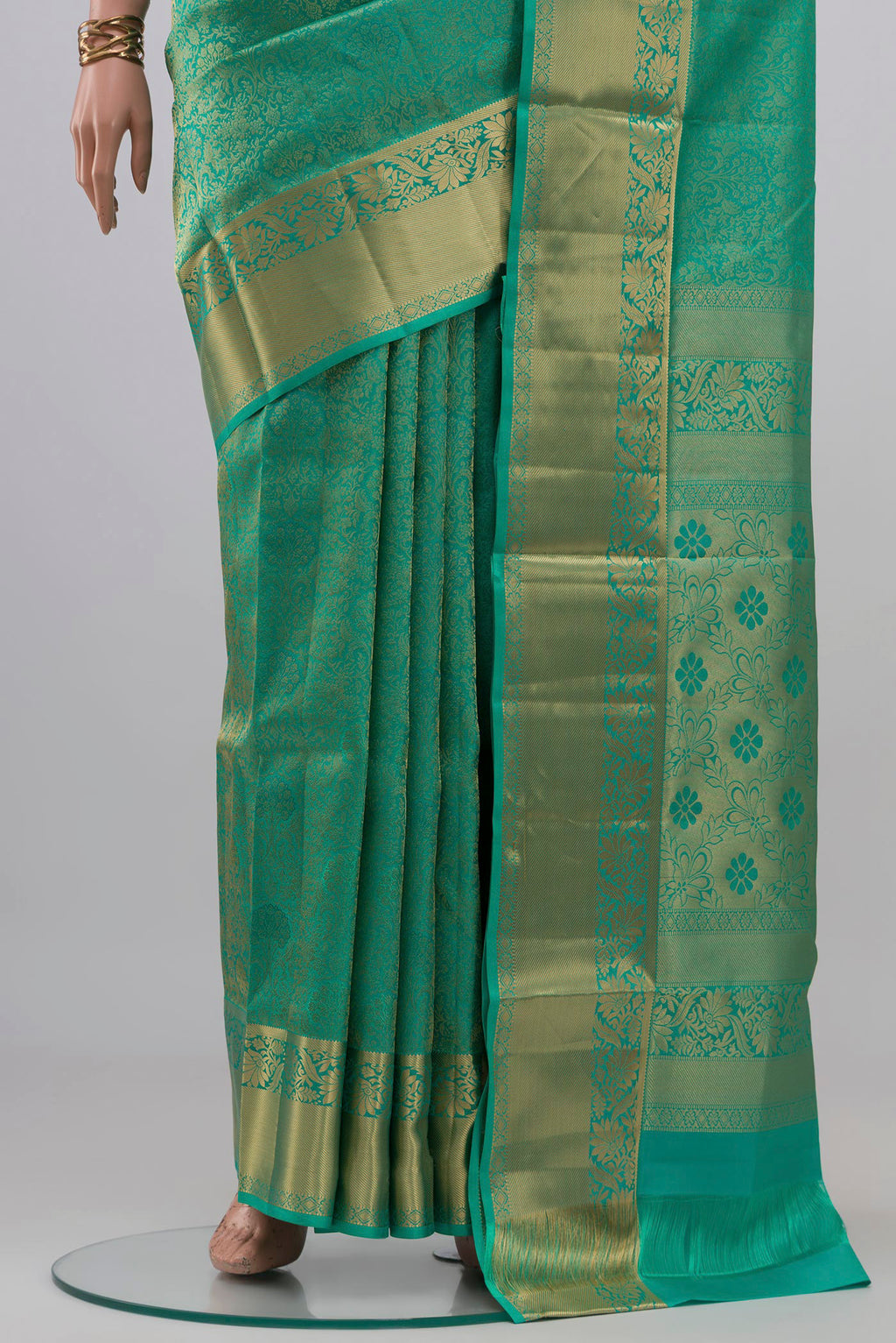 Pleats and pallu of Turquoise Soft Silk Saree with Zari Brocade on the body and Zari Border. 
