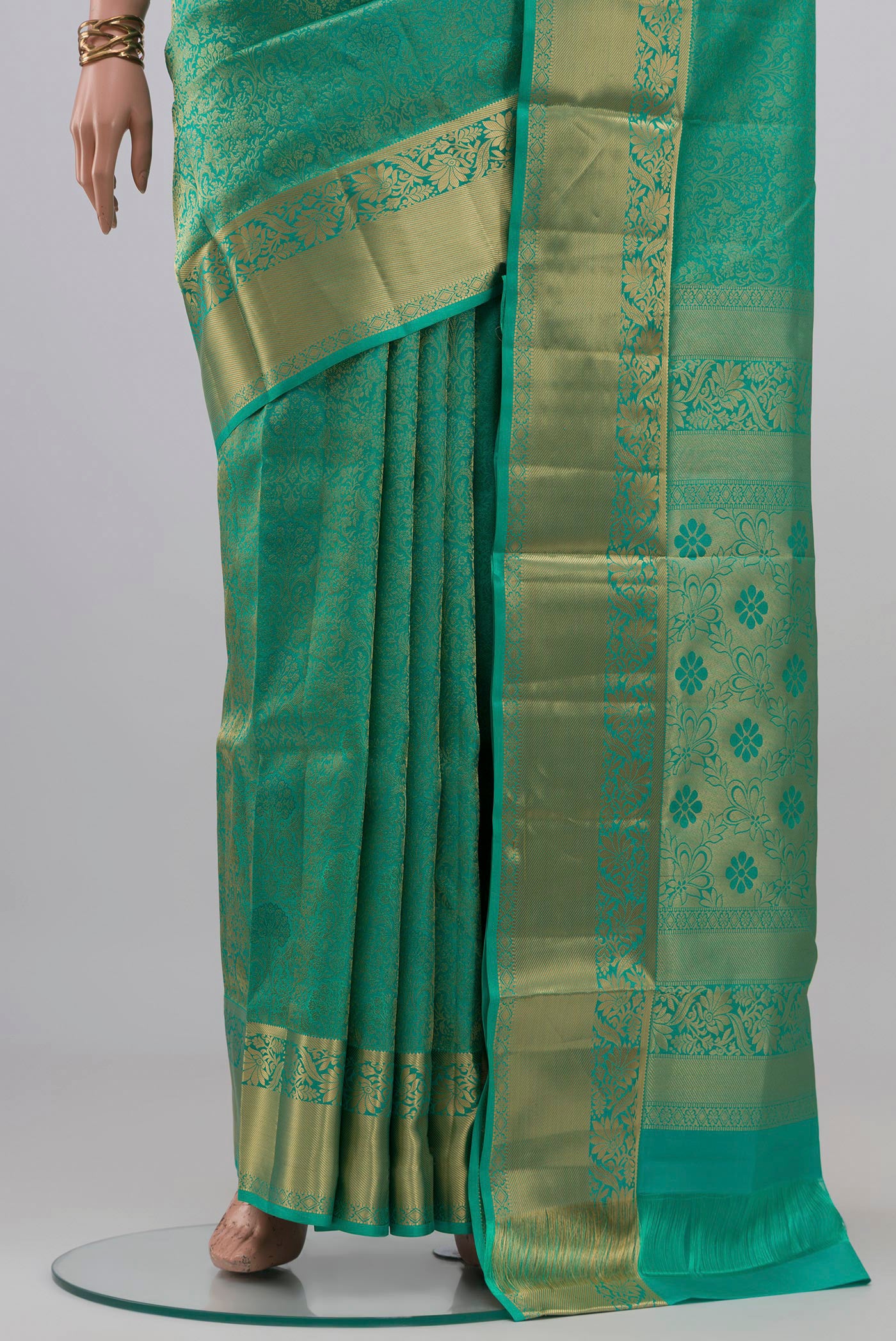 Pleats and pallu of Turquoise Soft Silk Saree with Zari Brocade on the body and Zari Border. 