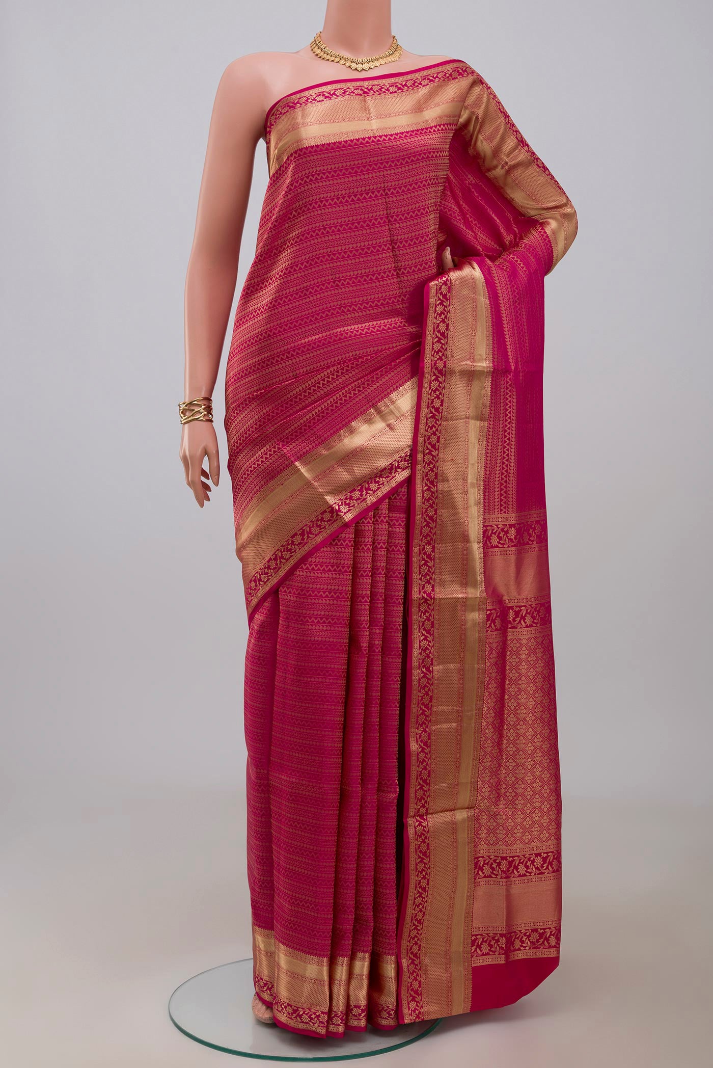 Pink Soft Silk Saree with Zari Brocade on the body and Zari Border.  displayed on a mannequin