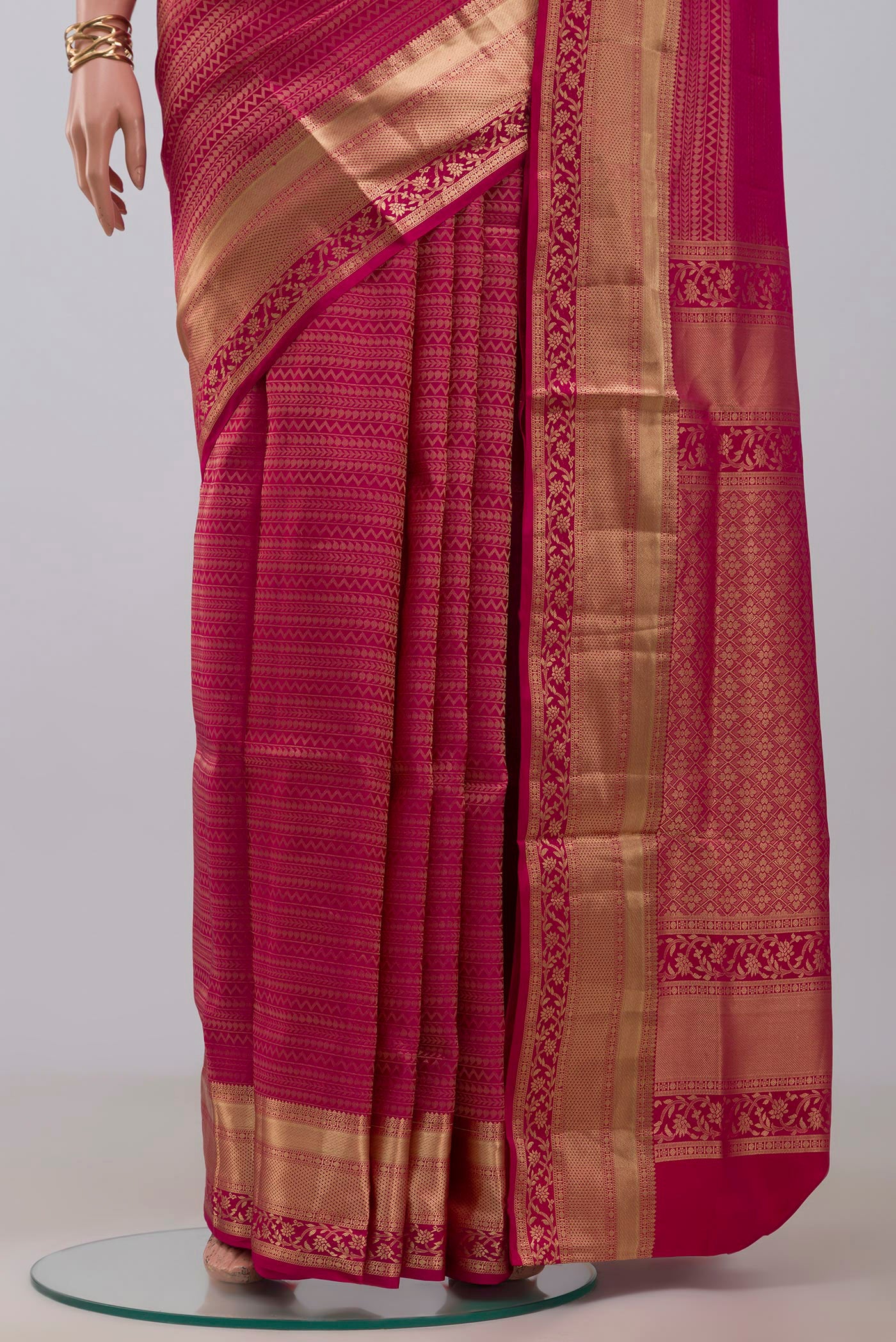 Pleats and pallu of Pink Soft Silk Saree with Zari Brocade on the body and Zari Border. 
