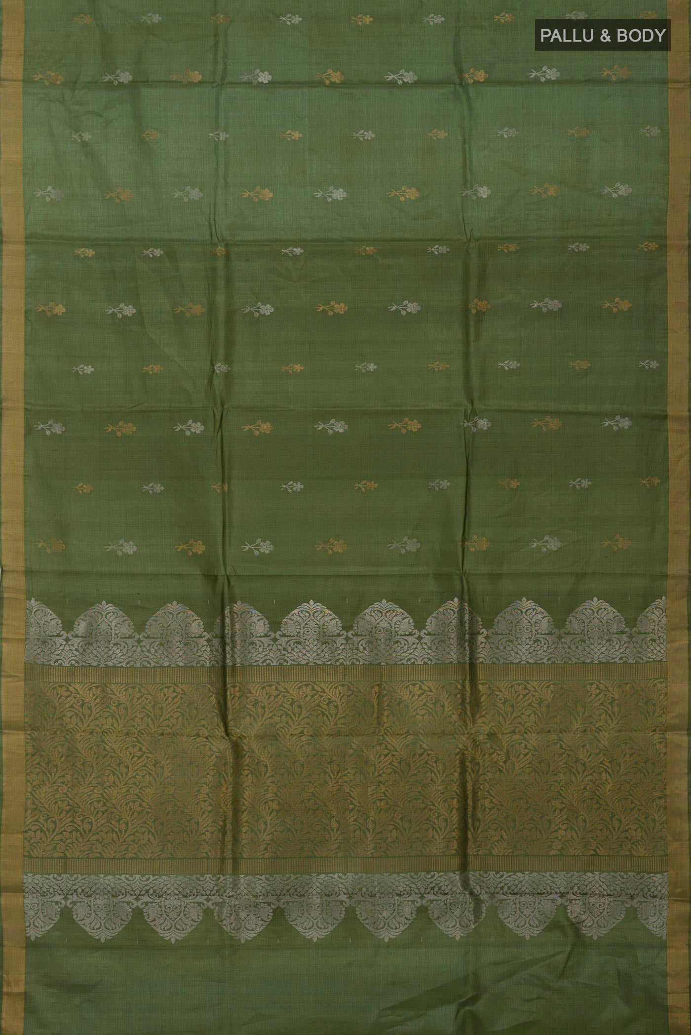 Flat view of Sage Green Tussar Silk Saree with Zari Butta on the body and Zari Border. 