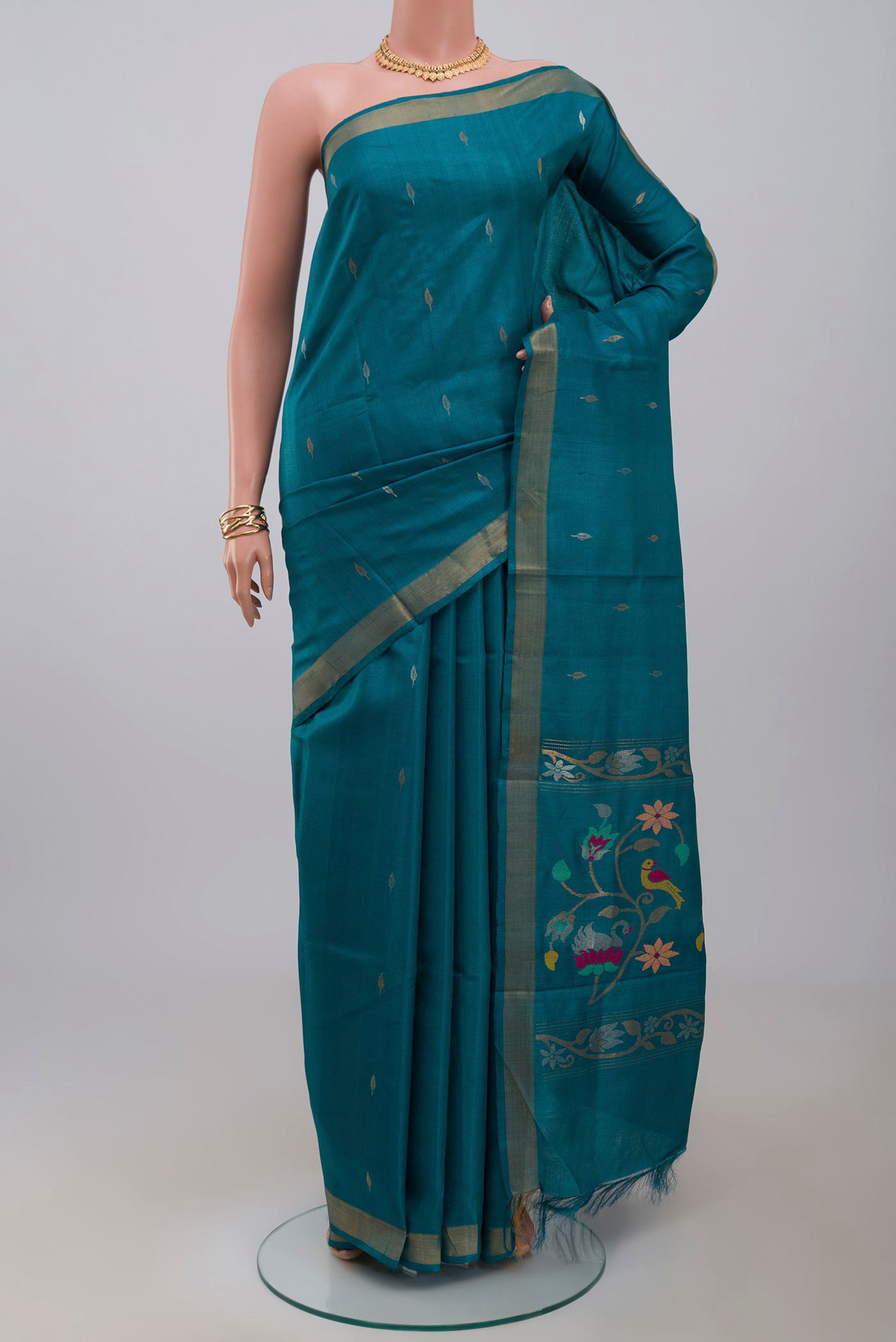 Sky Blue Tussar Silk Saree with Zari Butta on the body and Zari Border.  displayed on a mannequin