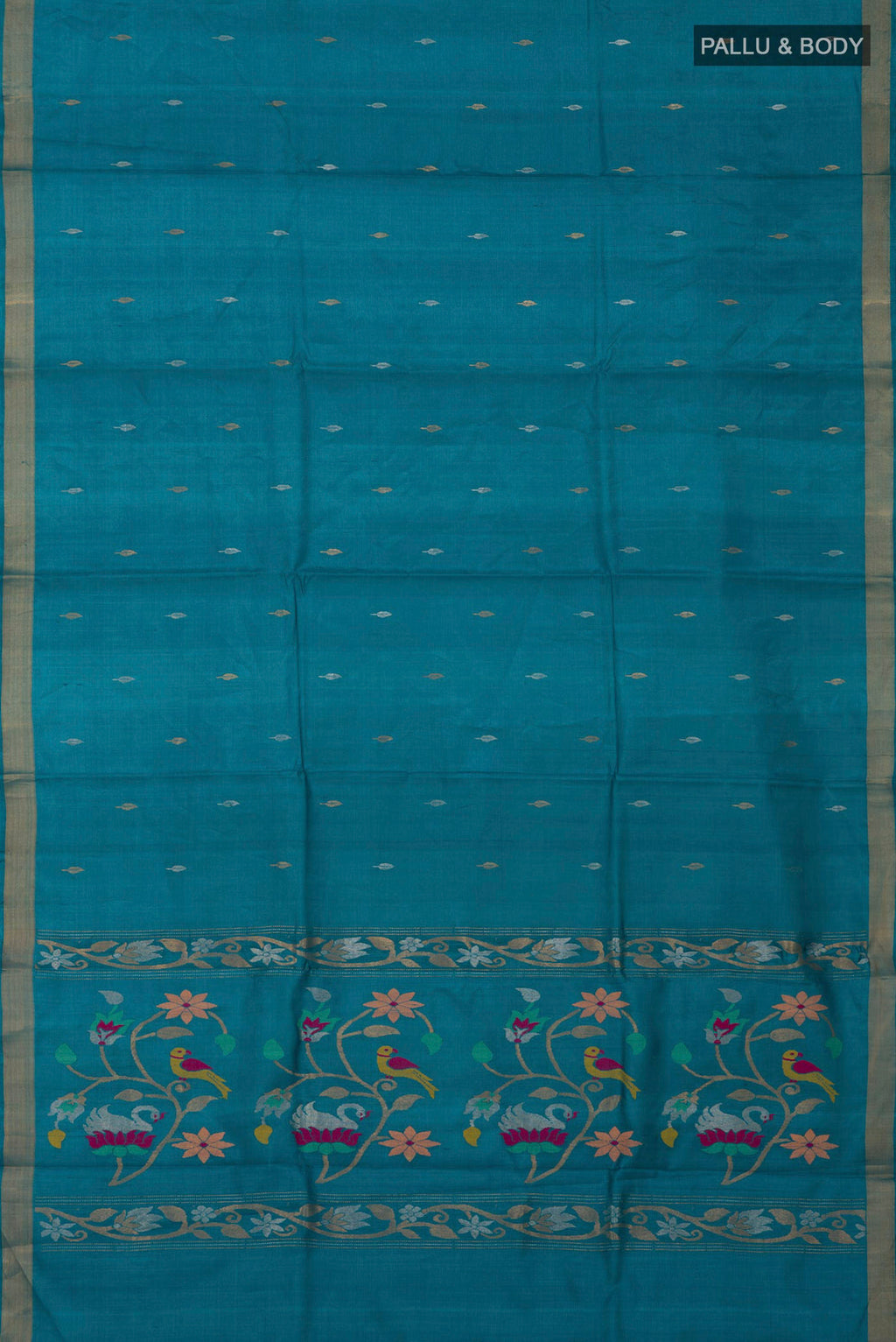 Flat view of Sky Blue Tussar Silk Saree with Zari Butta on the body and Zari Border. 