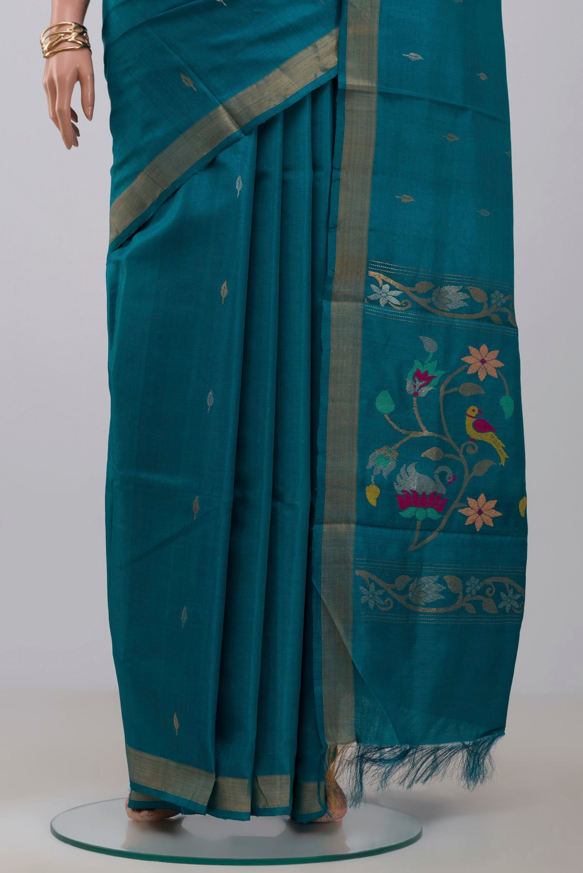 Pleats and pallu of Sky Blue Tussar Silk Saree with Zari Butta on the body and Zari Border. 
