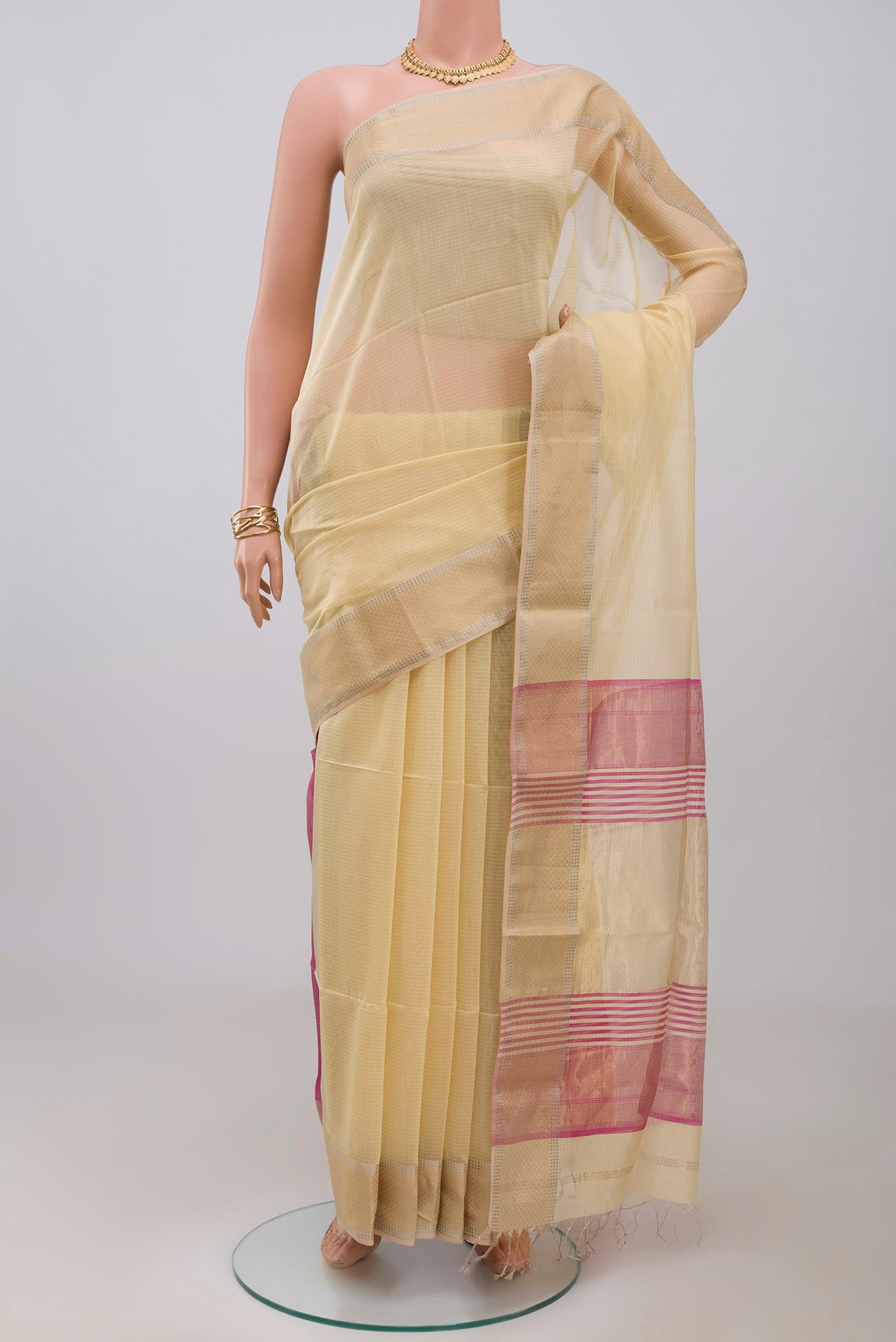 Yellow Maheshwari Silk Cotton Saree with Plain Body and Zari Border.  displayed on a mannequin
